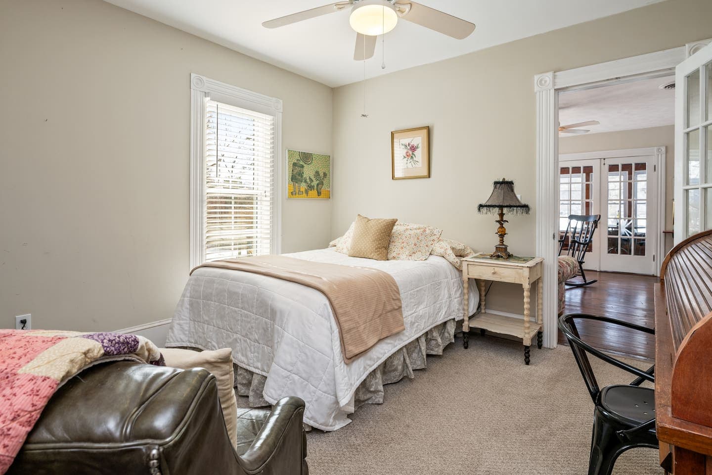 Bedroom with armchair and wooden nightstand