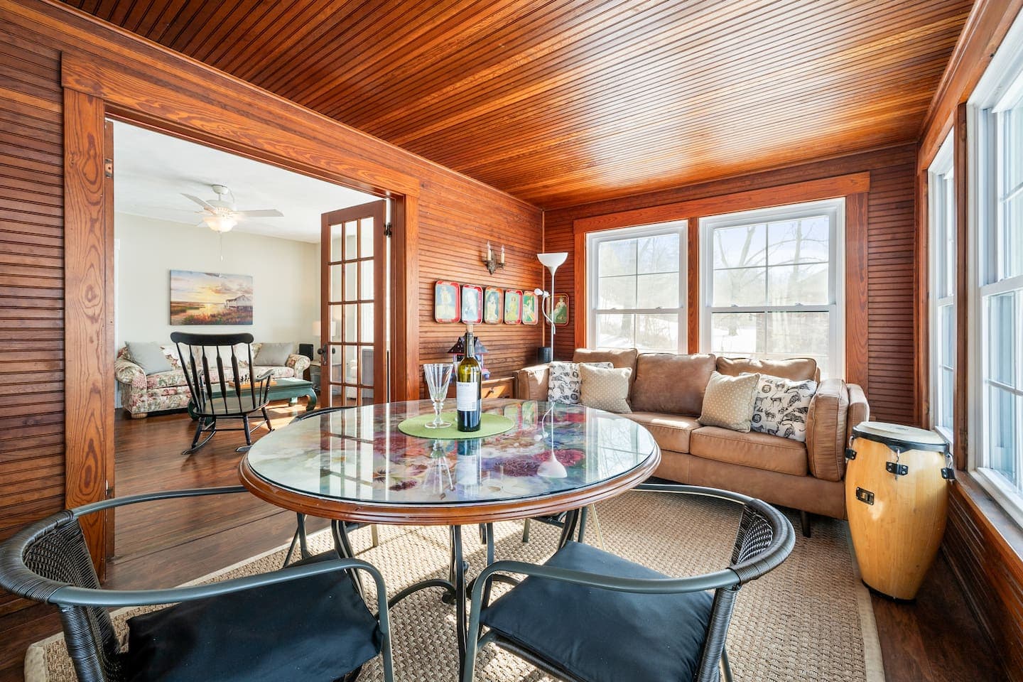 Wood-paneled sitting area with round table