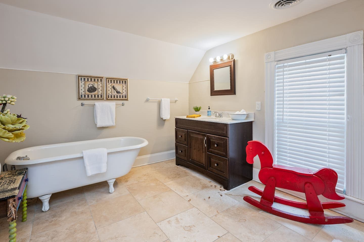 Bathroom with dark vanity and walk-in shower
