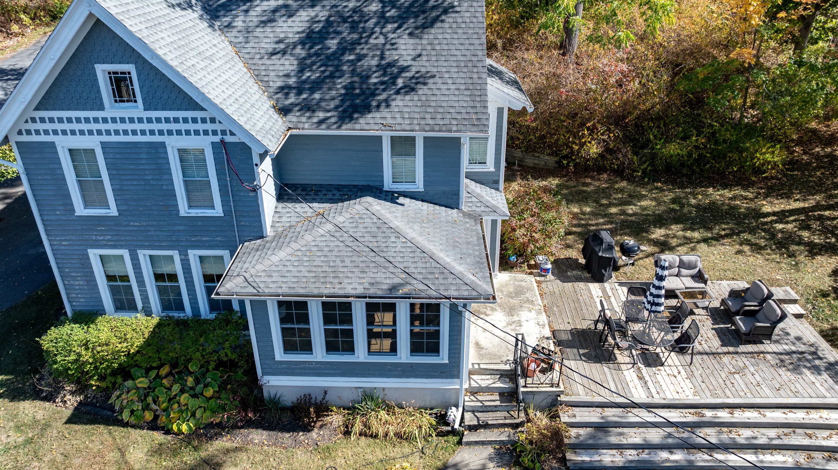 Blue house with stone patio