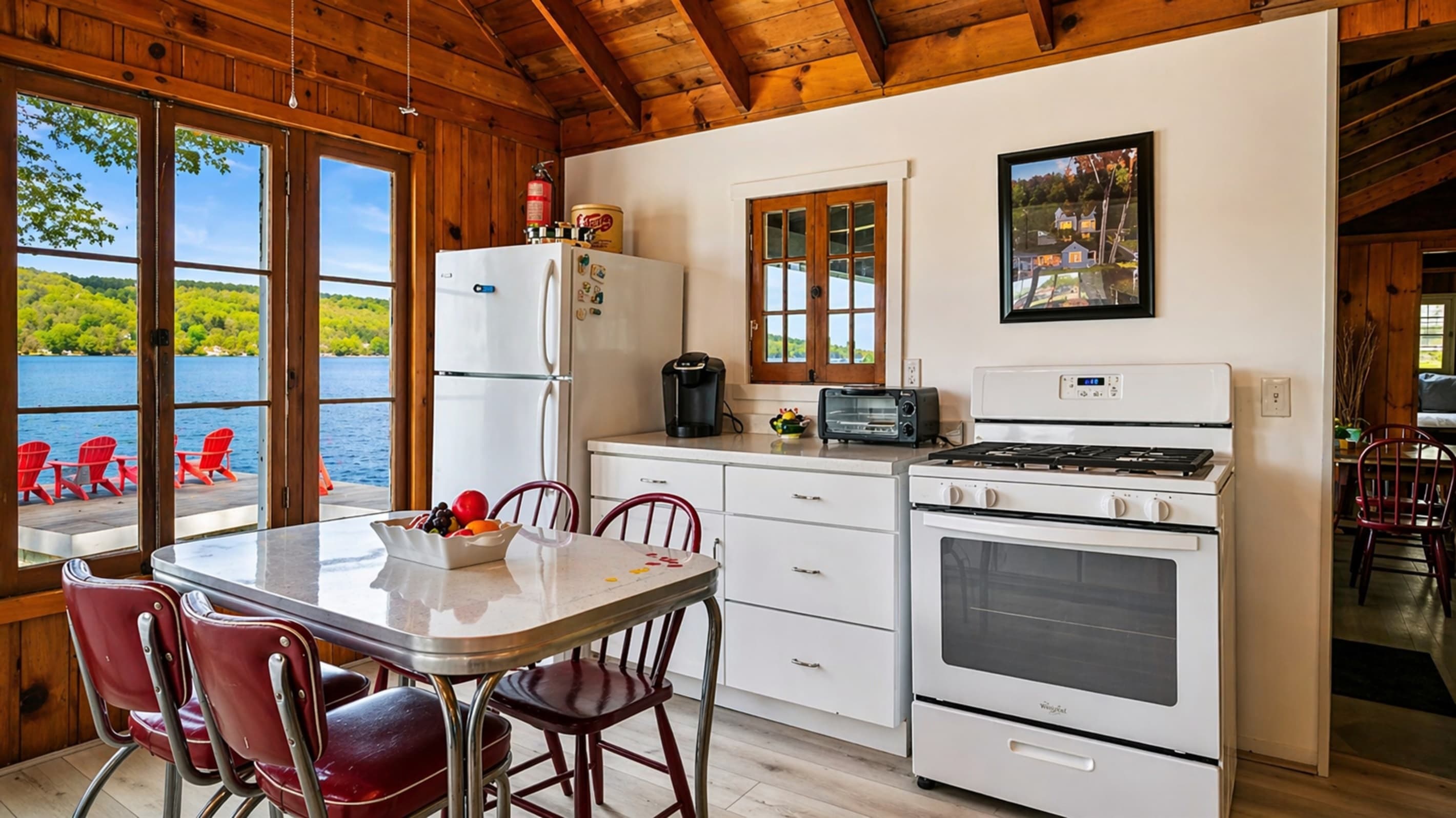 Dining table beside white kitchen appliances