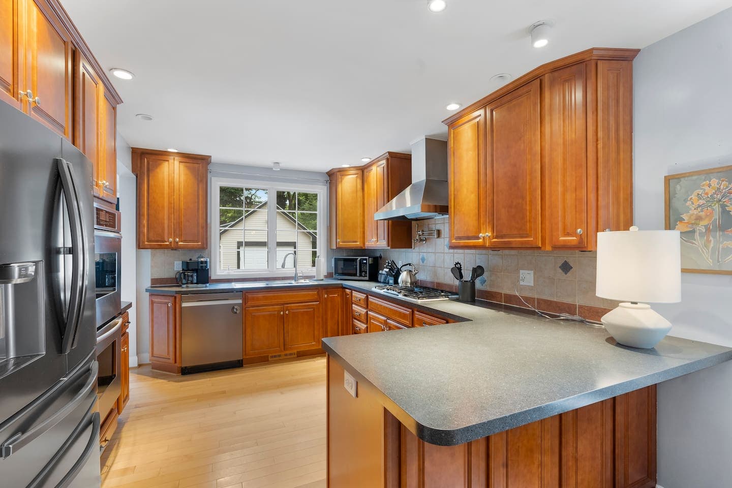 Fully equipped kitchen with wooden cabinetry