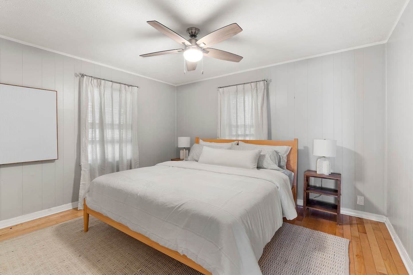 Bed beneath a ceiling fan