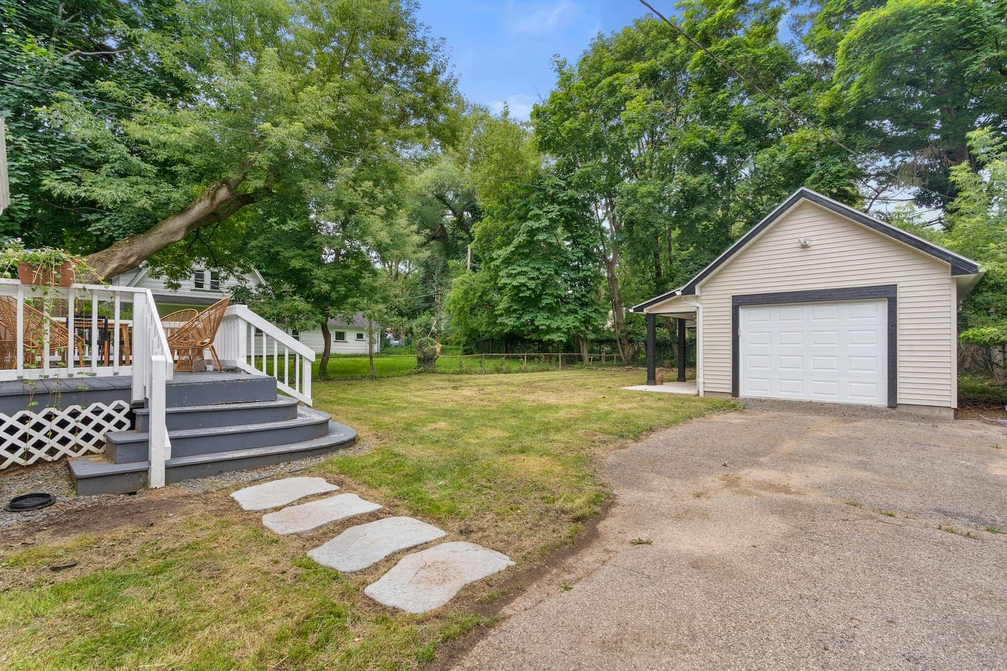 Deck stairs leading toward the driveway