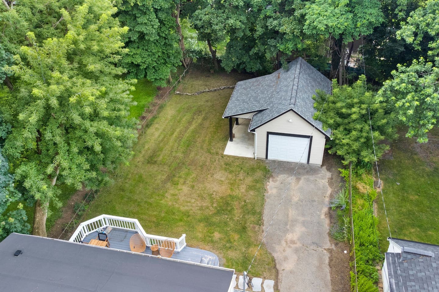 Aerial view of house and garage