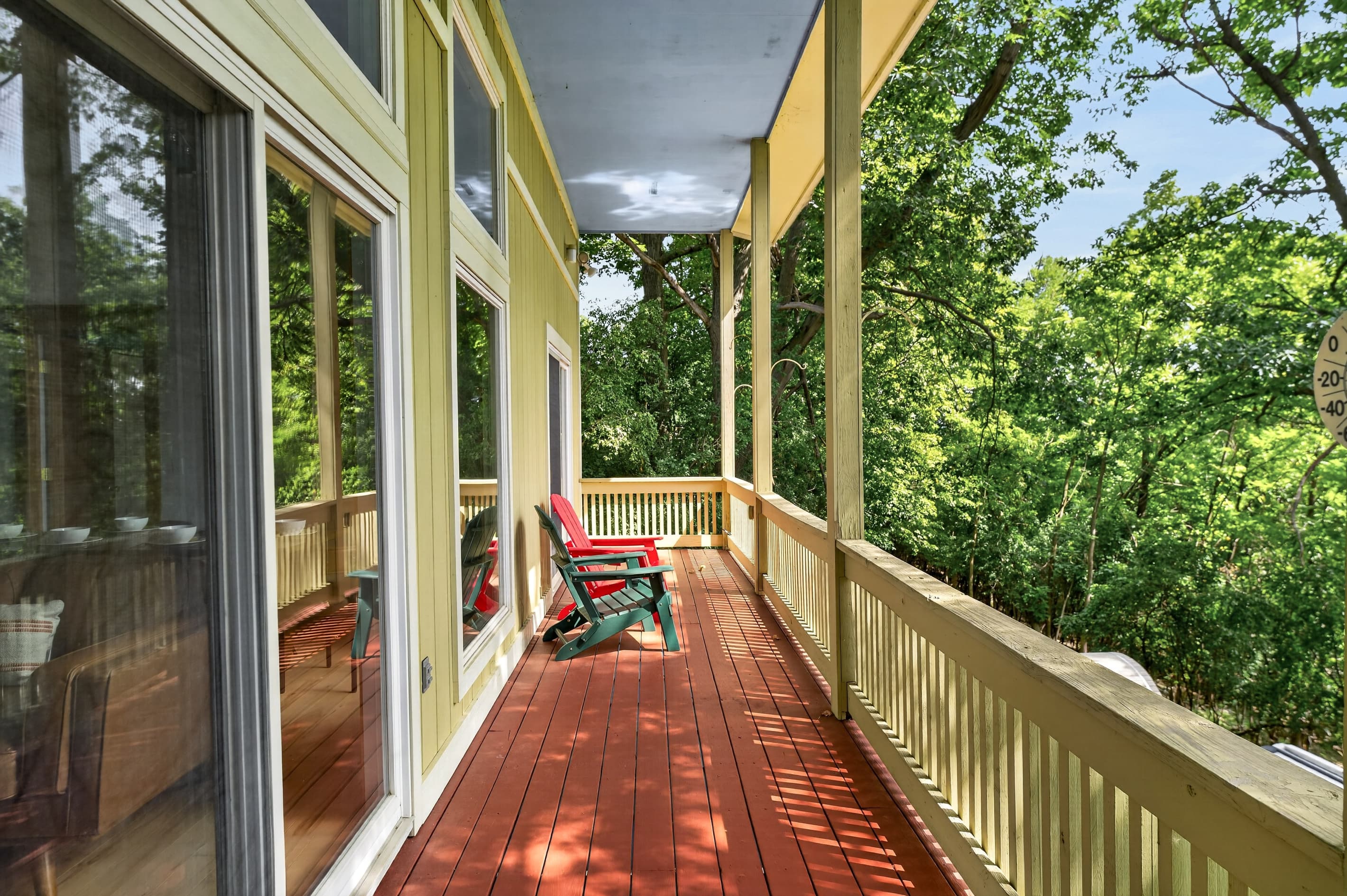 Covered porch overlooking the trees