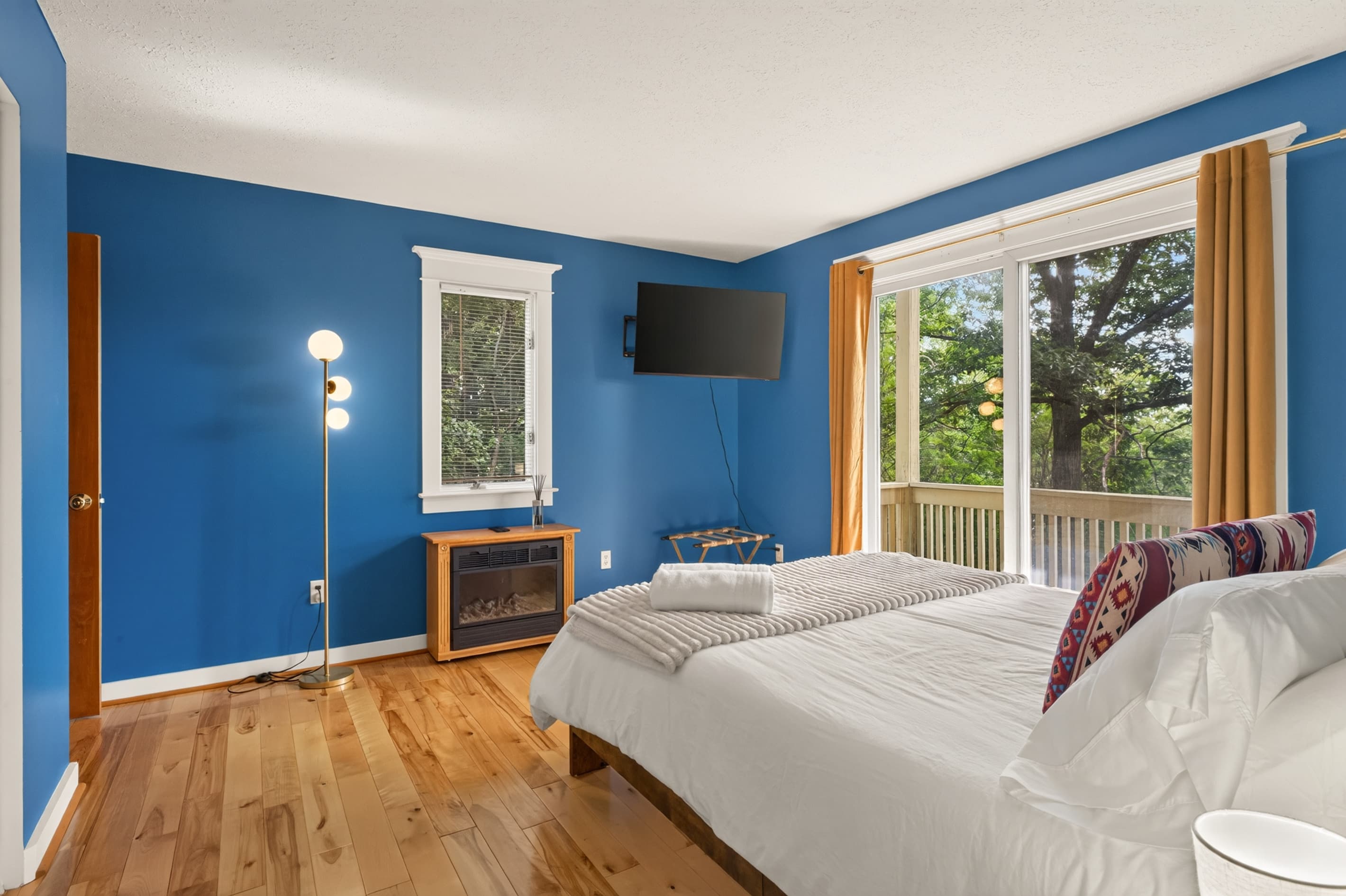 Blue bedroom with balcony access