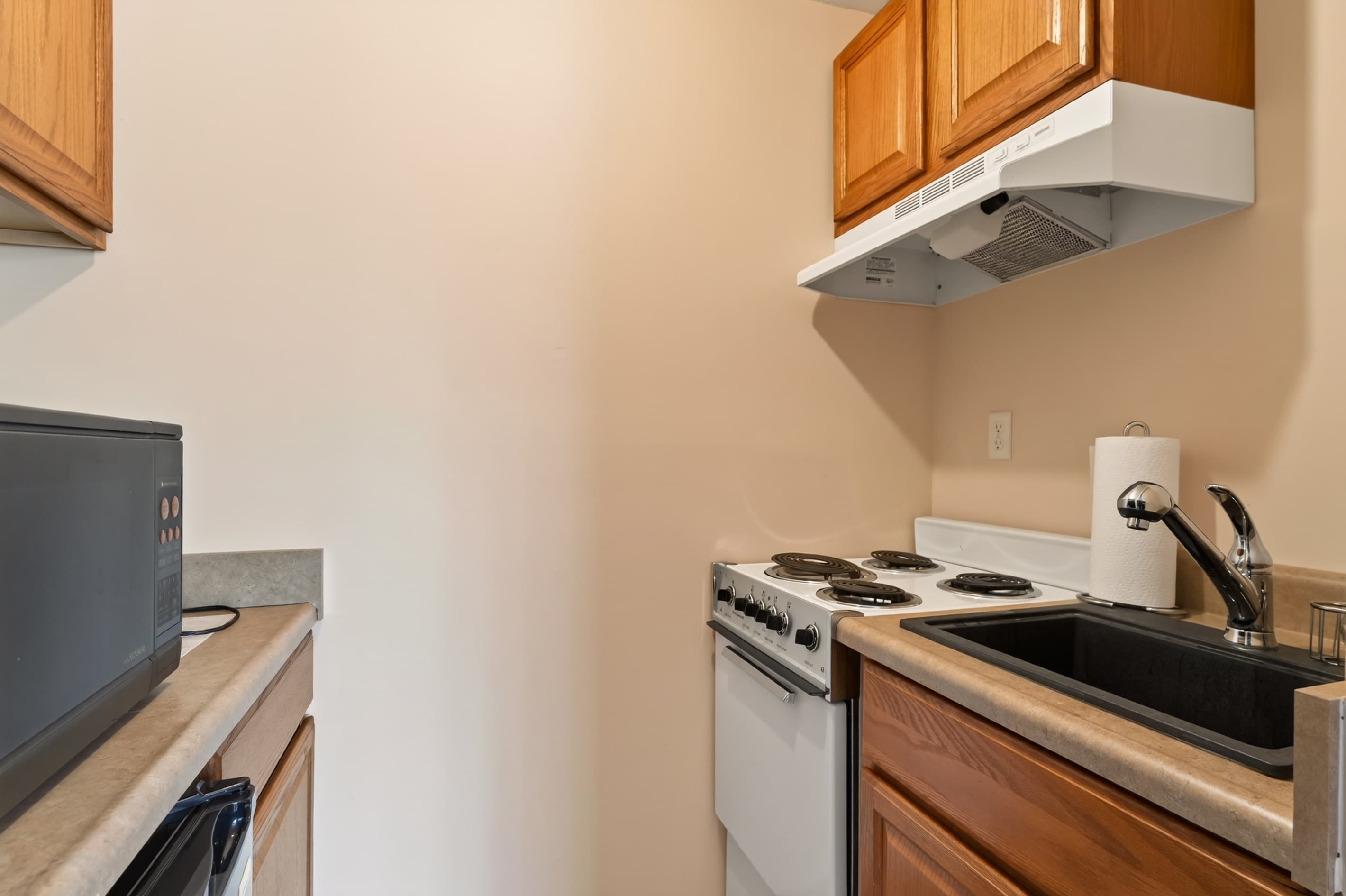 Compact kitchenette with stovetop and sink
