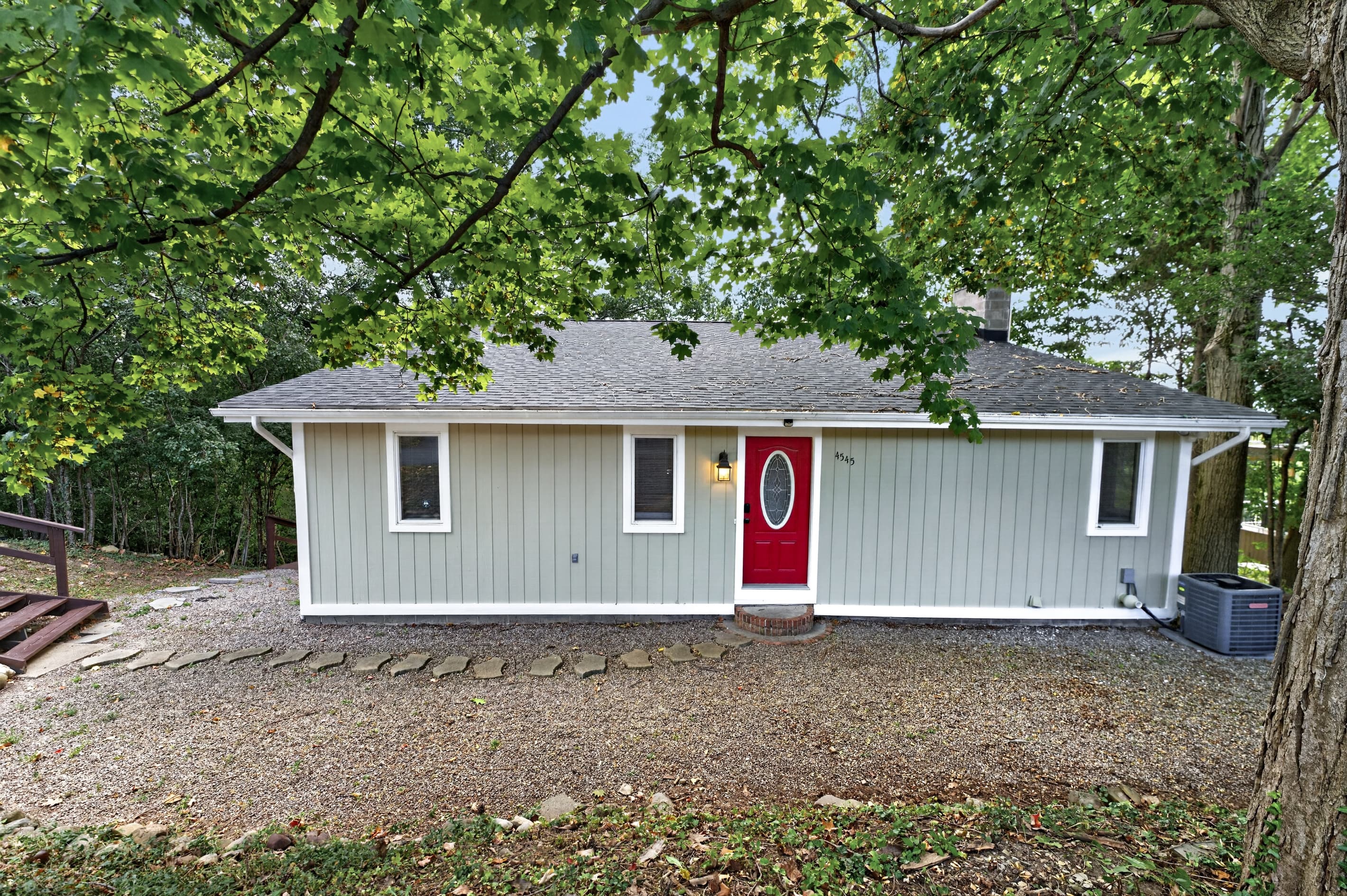 Front exterior with red entry door