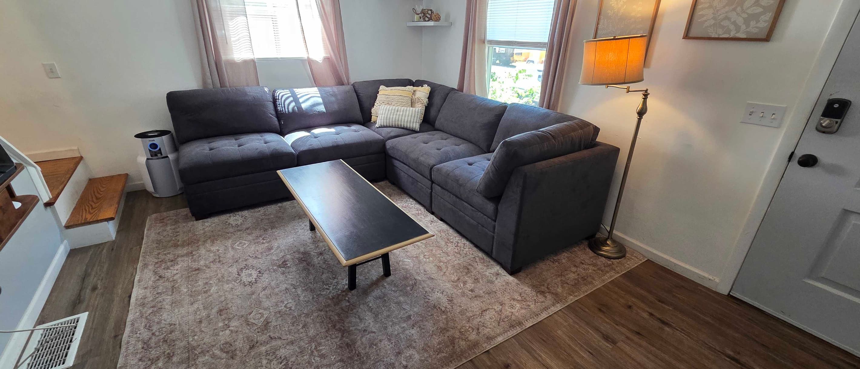 Sectional sofa surrounding a rectangular coffee table
