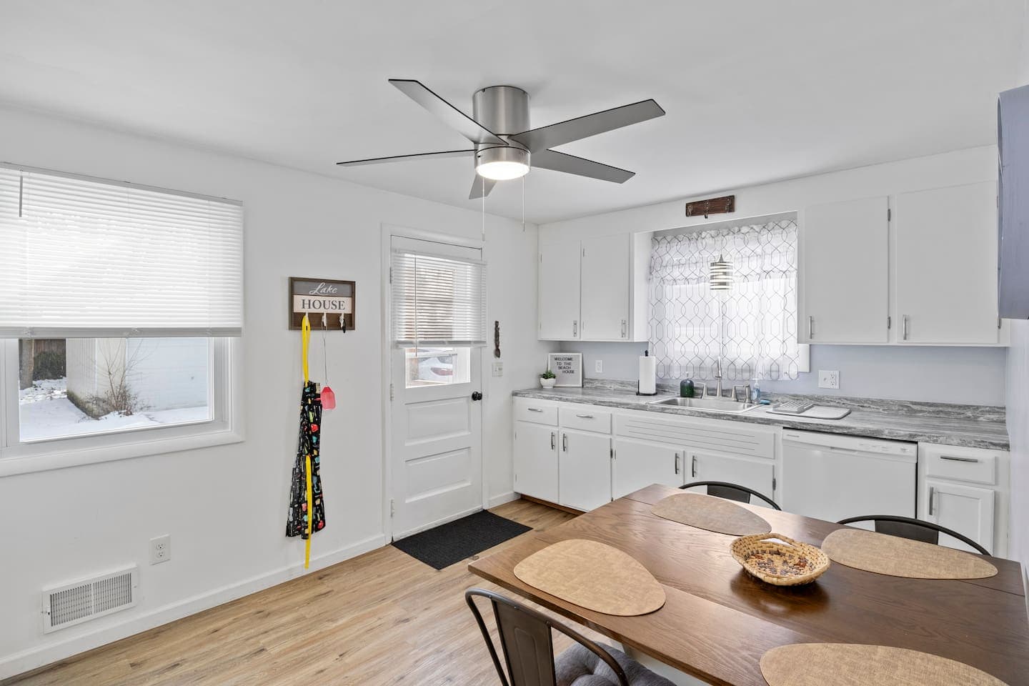 White kitchen with adjoining dining table