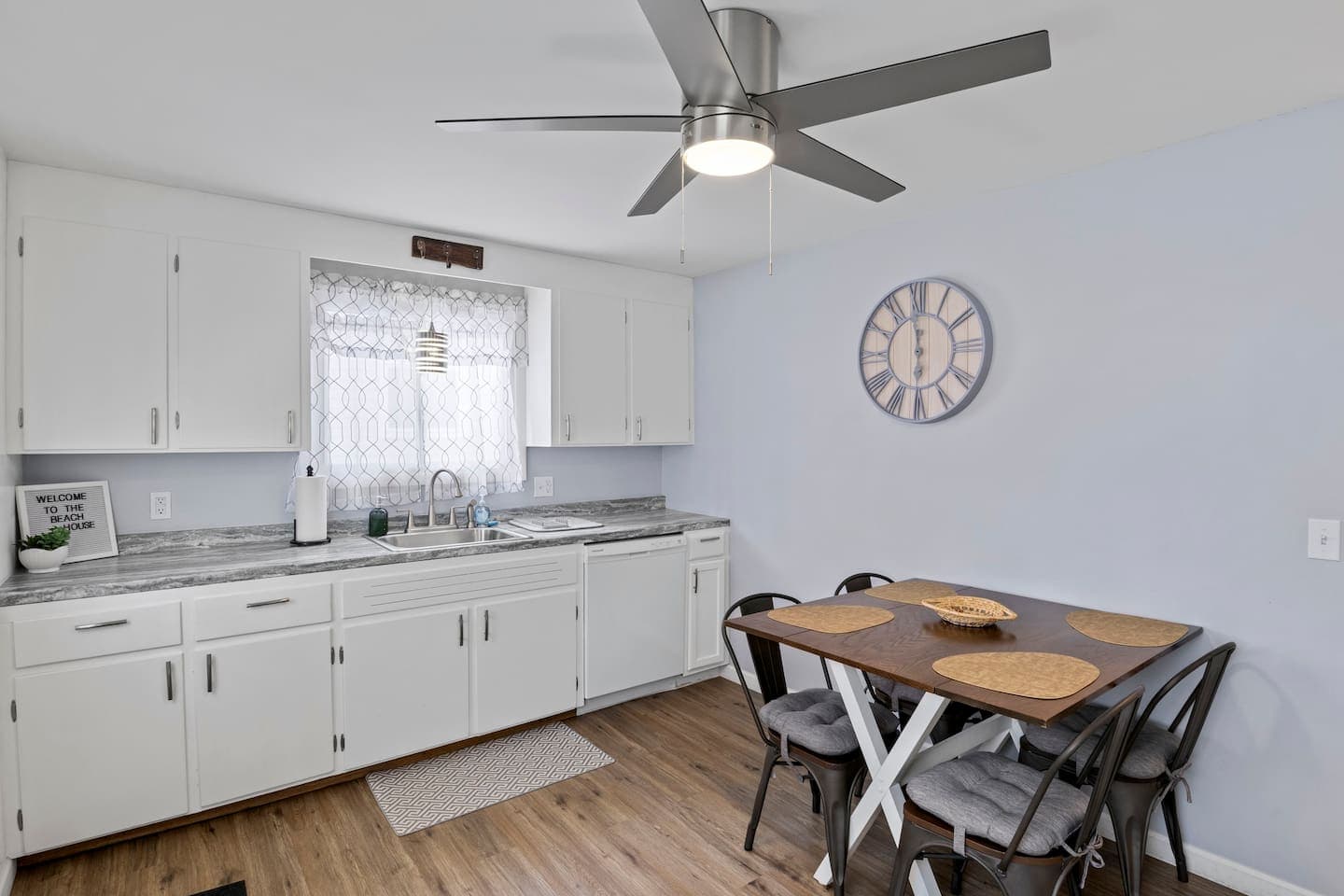 Kitchen cabinets surrounding the window