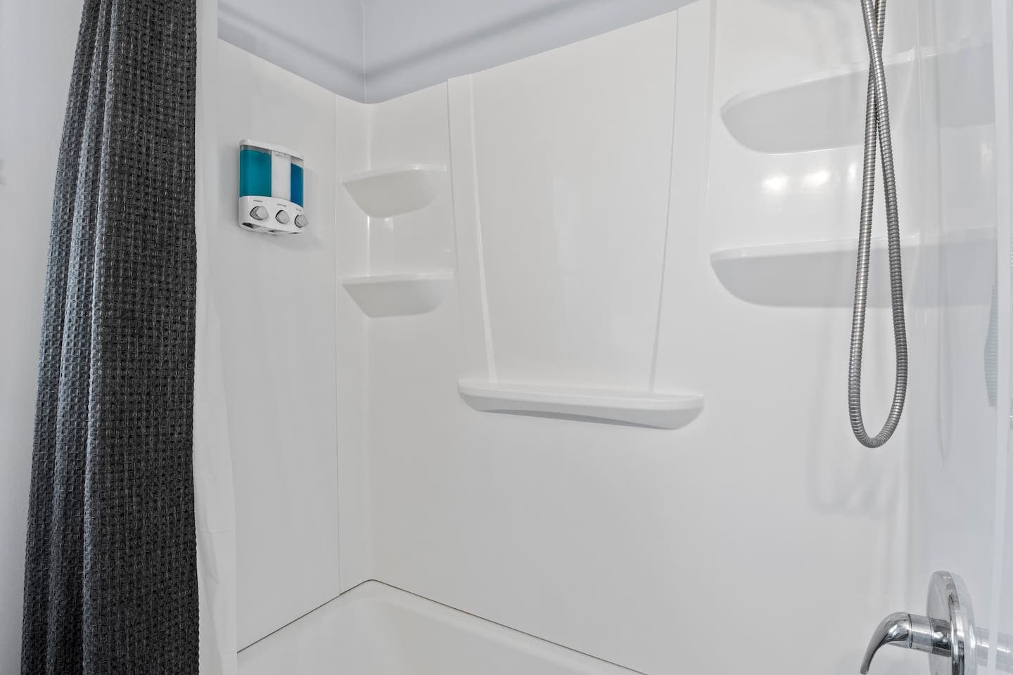 Shower enclosure with dark curtain