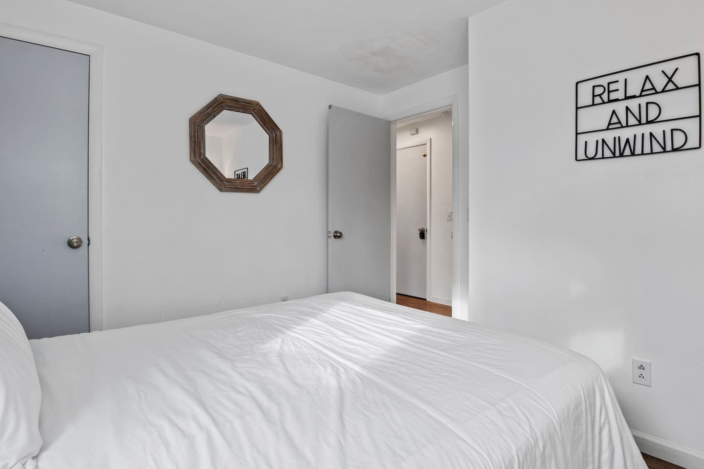 Bed facing open doorway 
