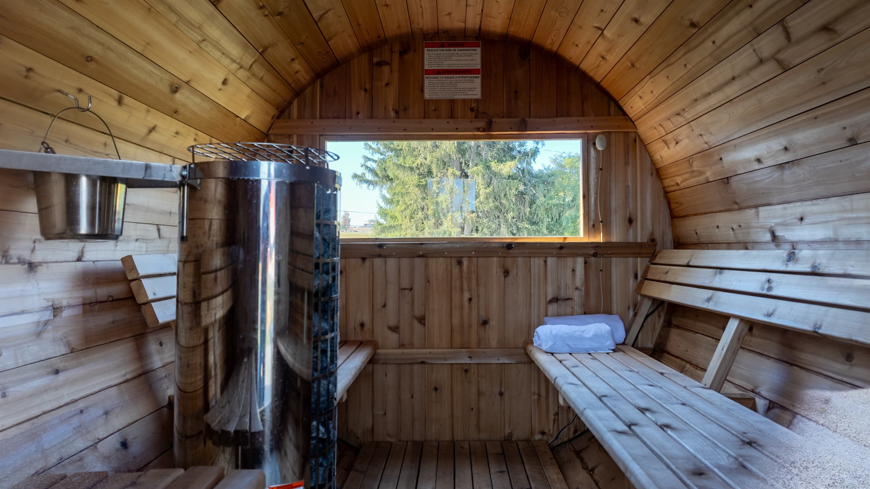 Barrel sauna with wooden bench seating