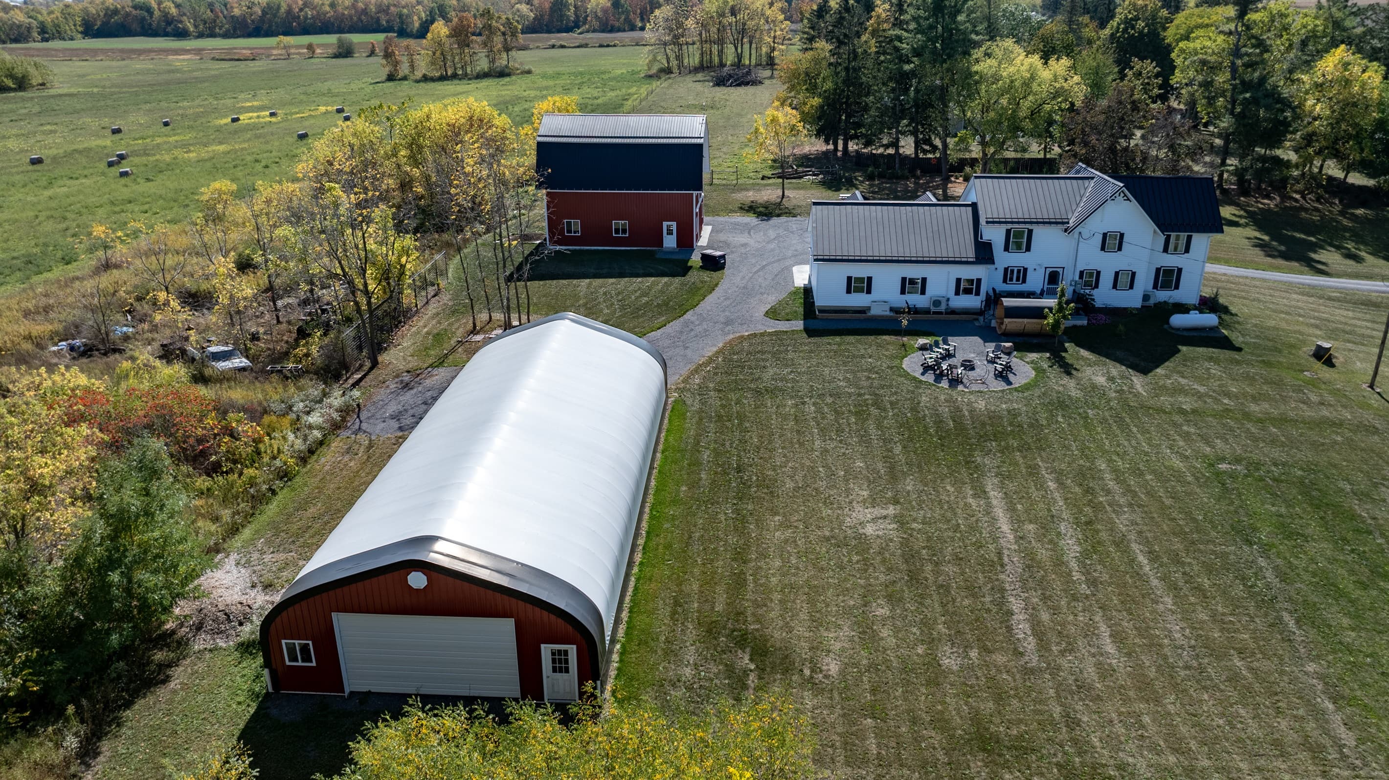 Overhead view of farmhouse, barn, and driveway