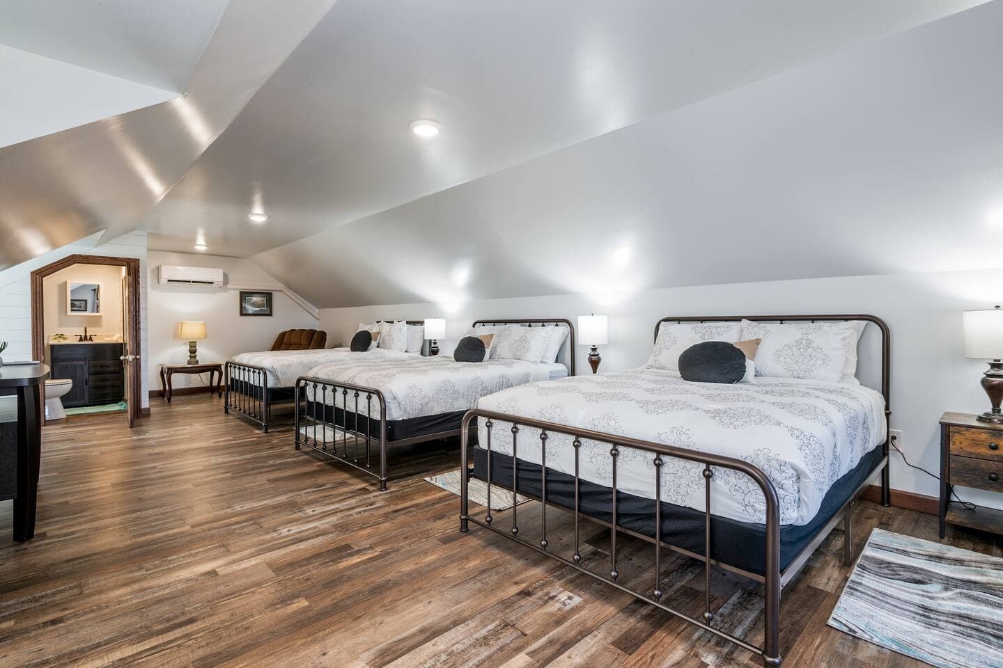 Loft sleeping area with multiple beds