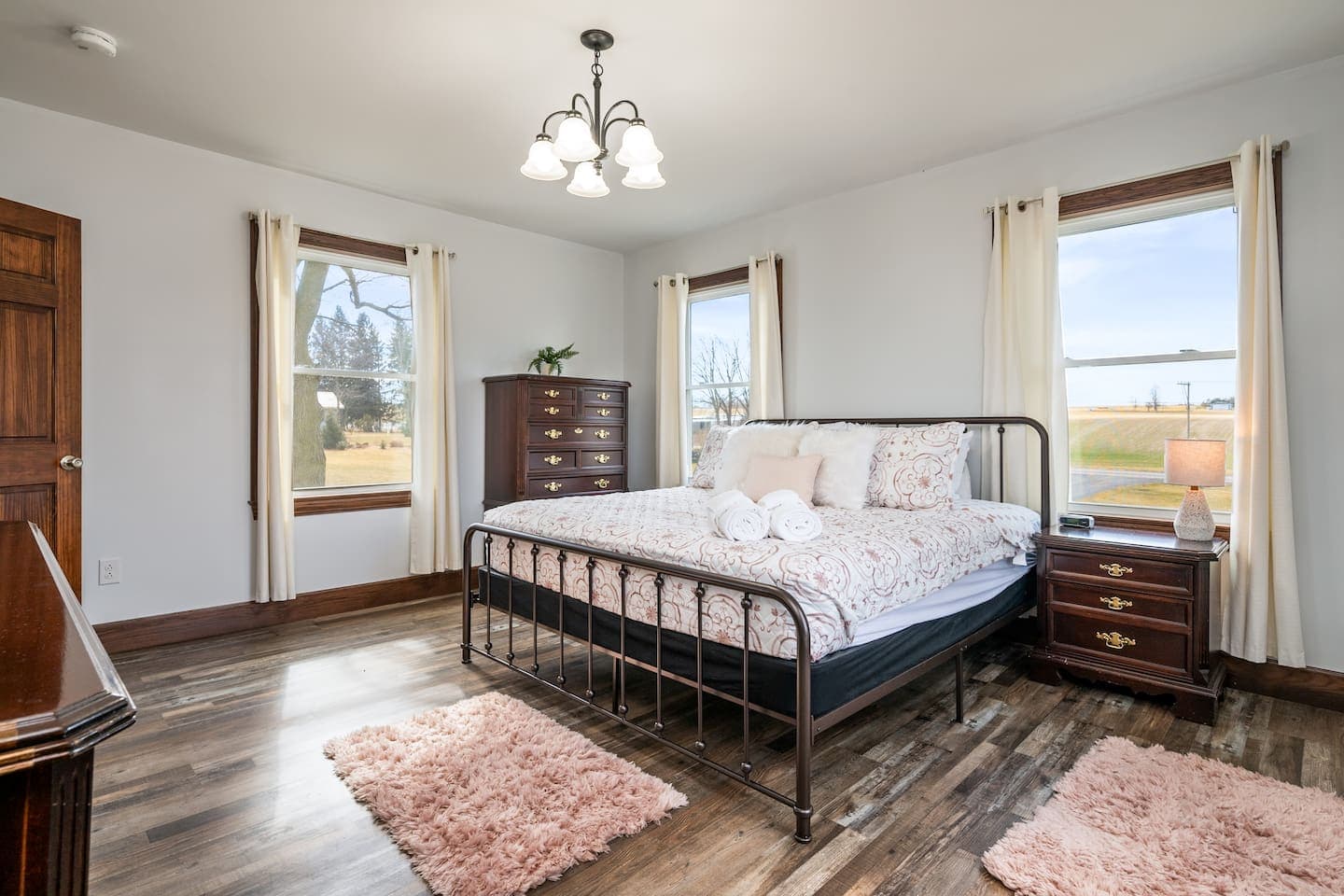 Bedroom with metal bed frame and windows