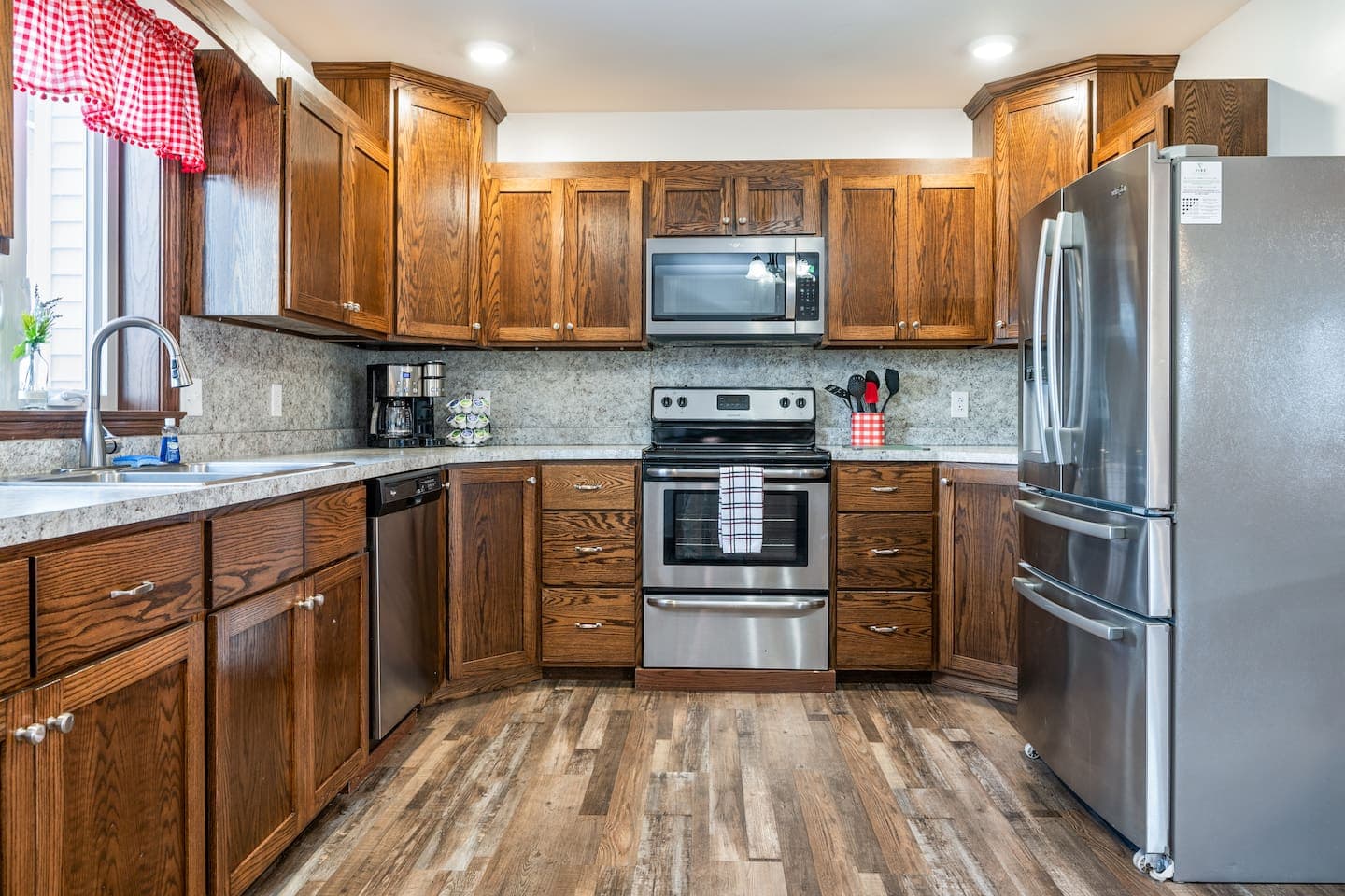 Kitchen with wood cabinetry and stainless refrigerator