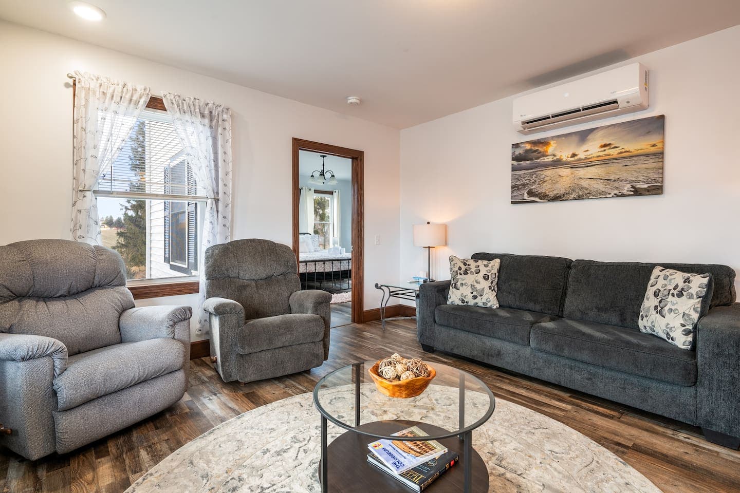 Living room with sofa and recliner seating