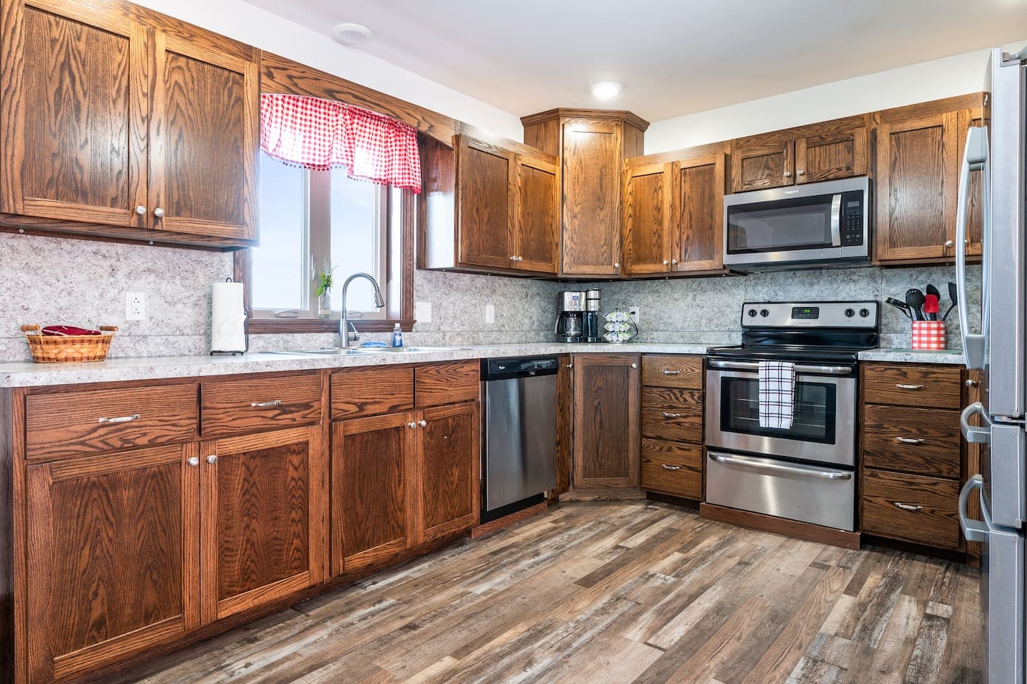 Kitchen with wood cabinetry and stainless appliances