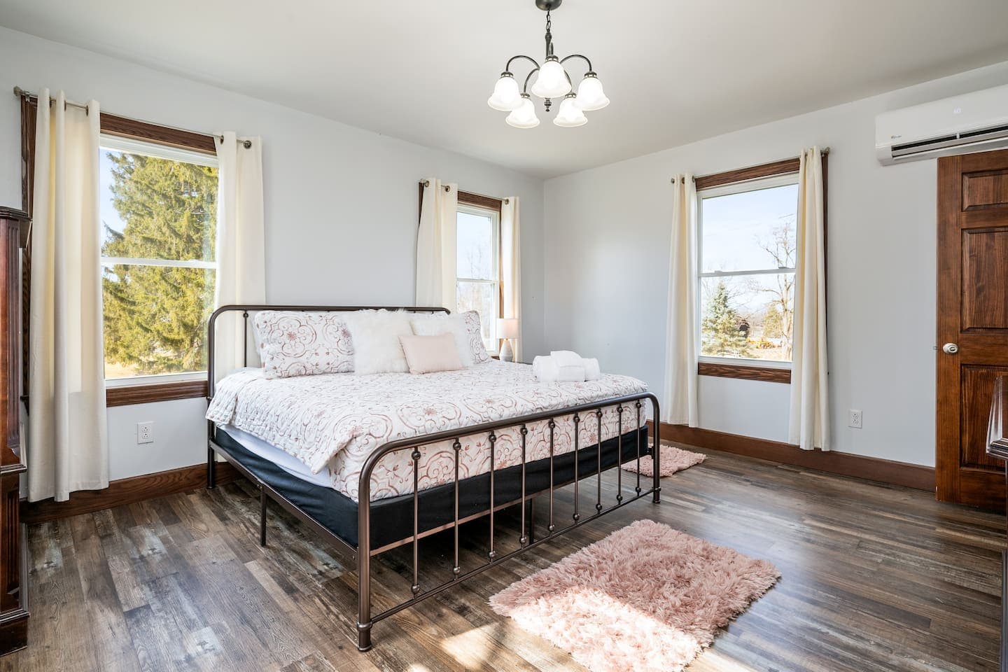 Bedroom with metal bed frame and windows