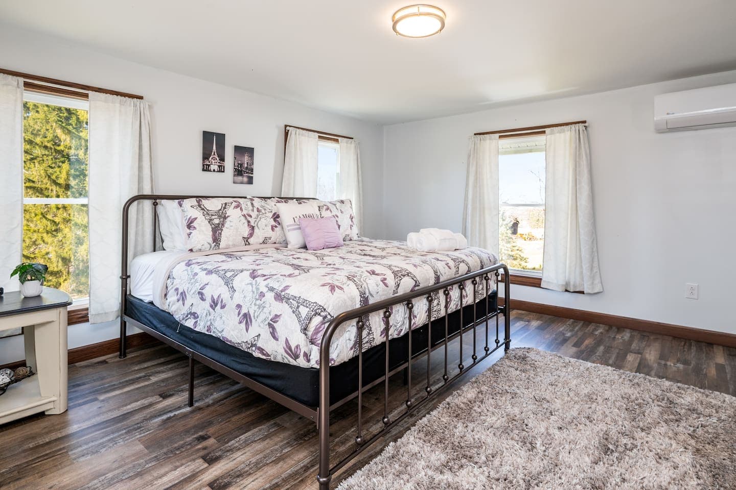 Floral bedroom with black metal bed frame