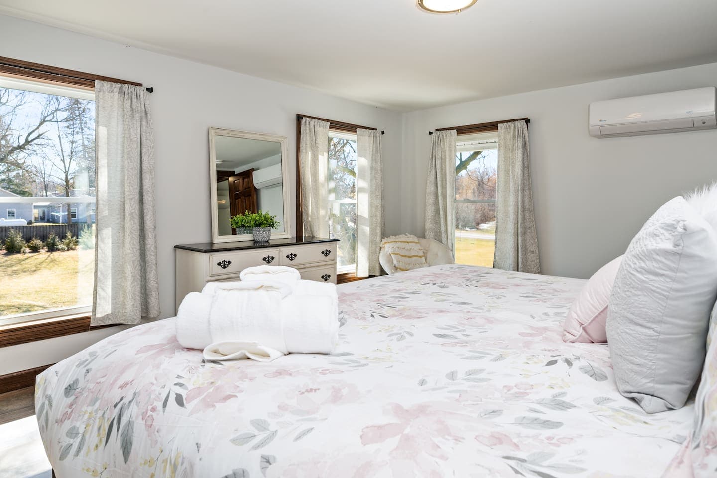 Bedroom with floral linens and matching nightstands
