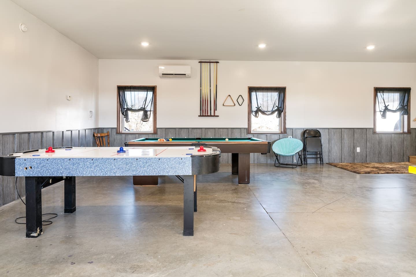 Game room with air hockey and pool table