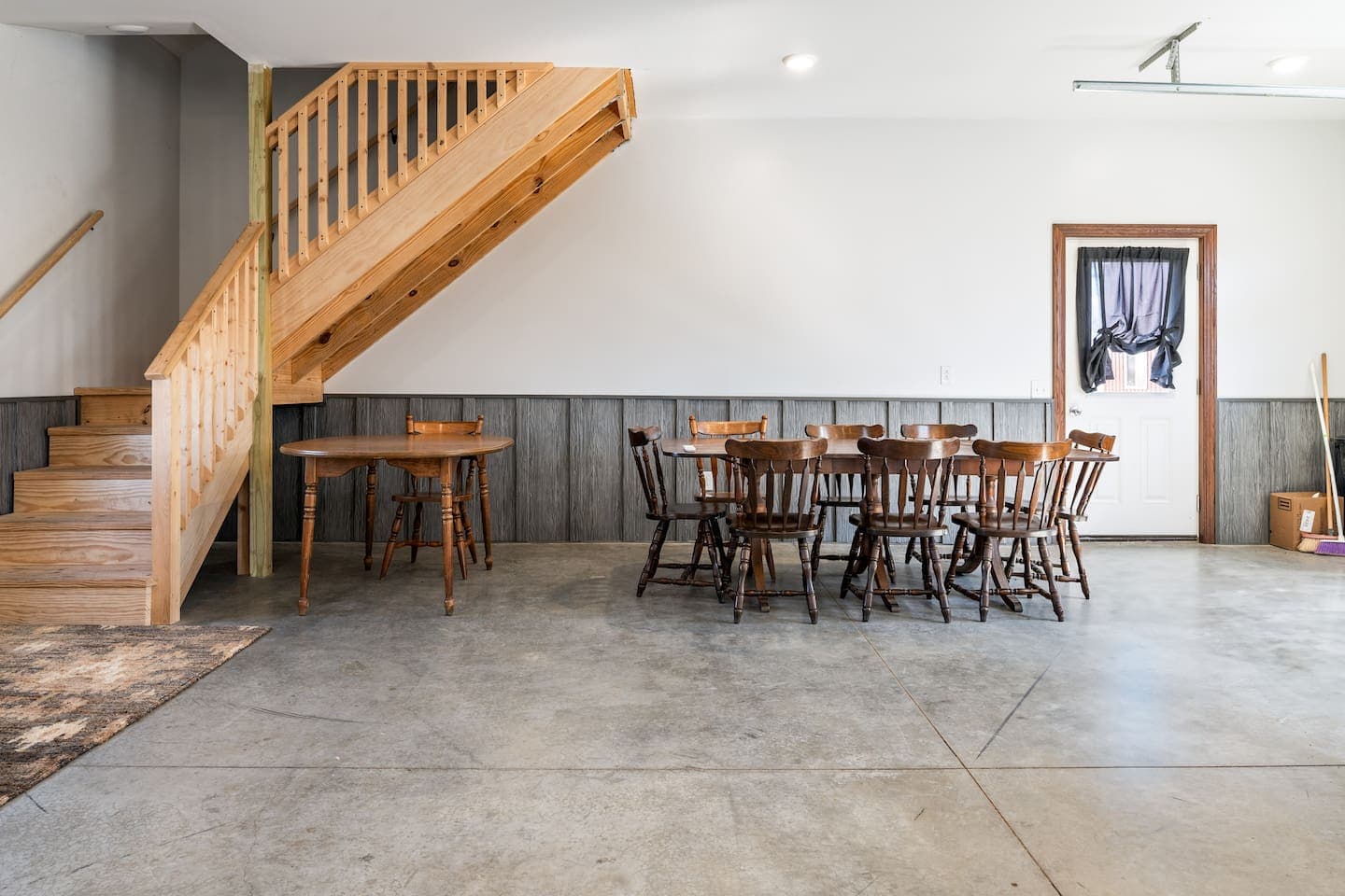 Open interior space with wooden stair railing