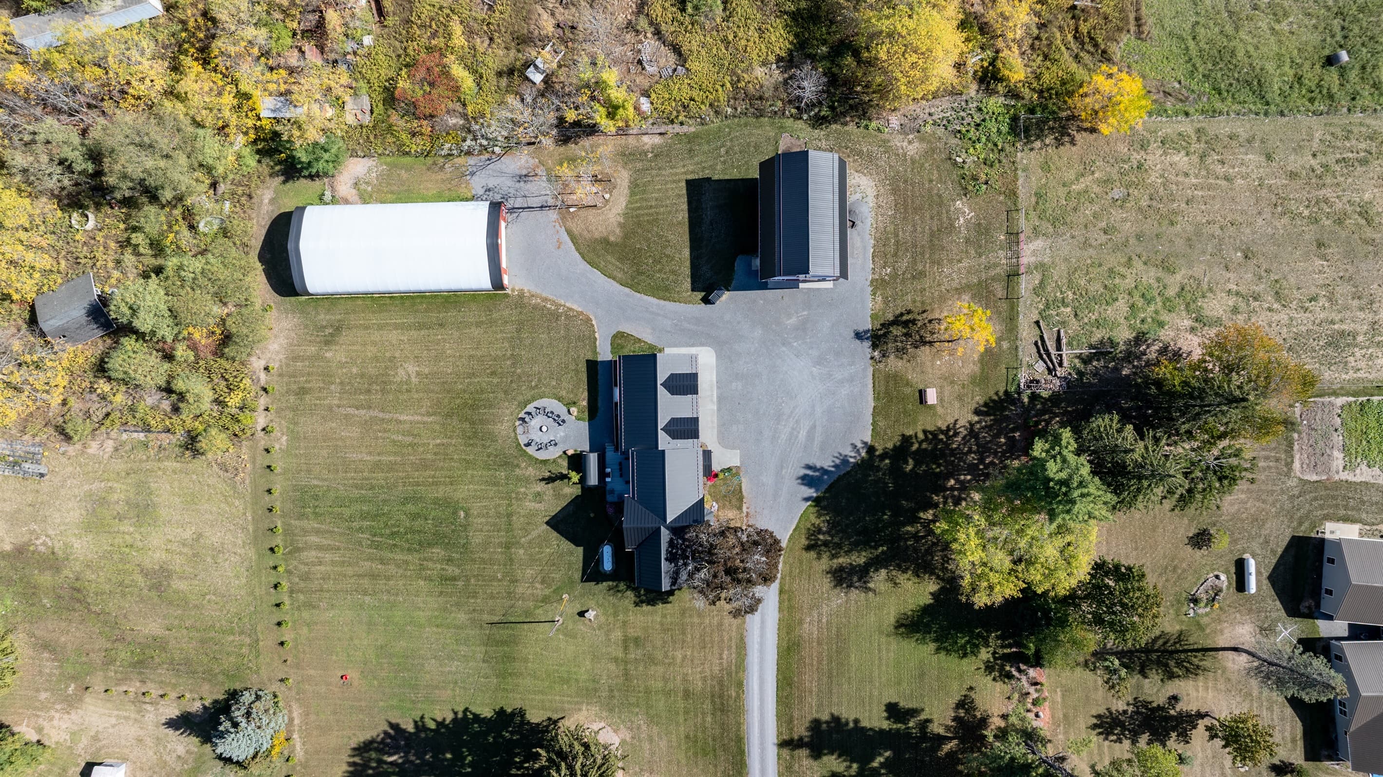 Aerial view of the property and outbuildings