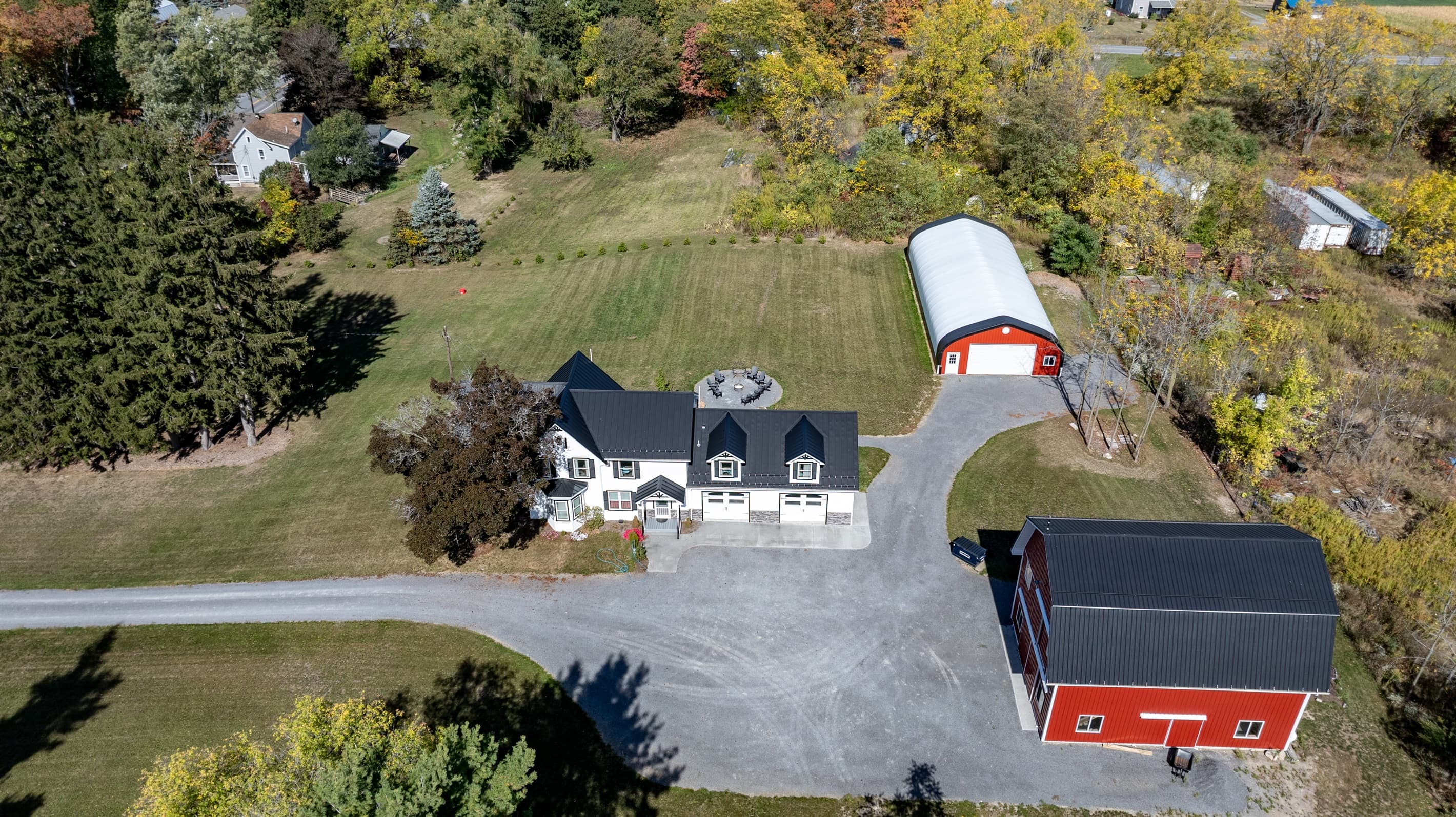 Overhead view of the home and red barn