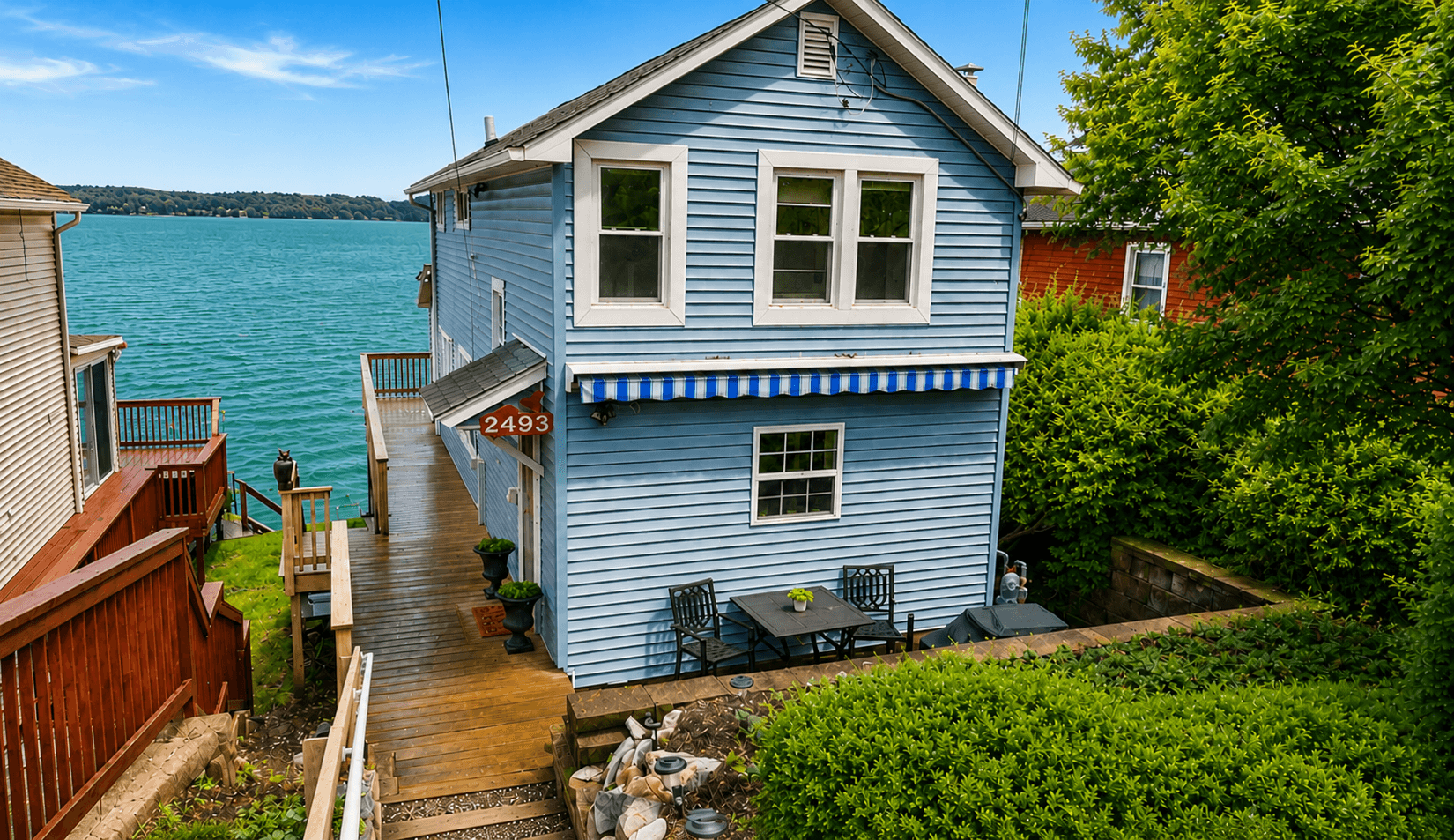 Blue cottage exterior near the shoreline