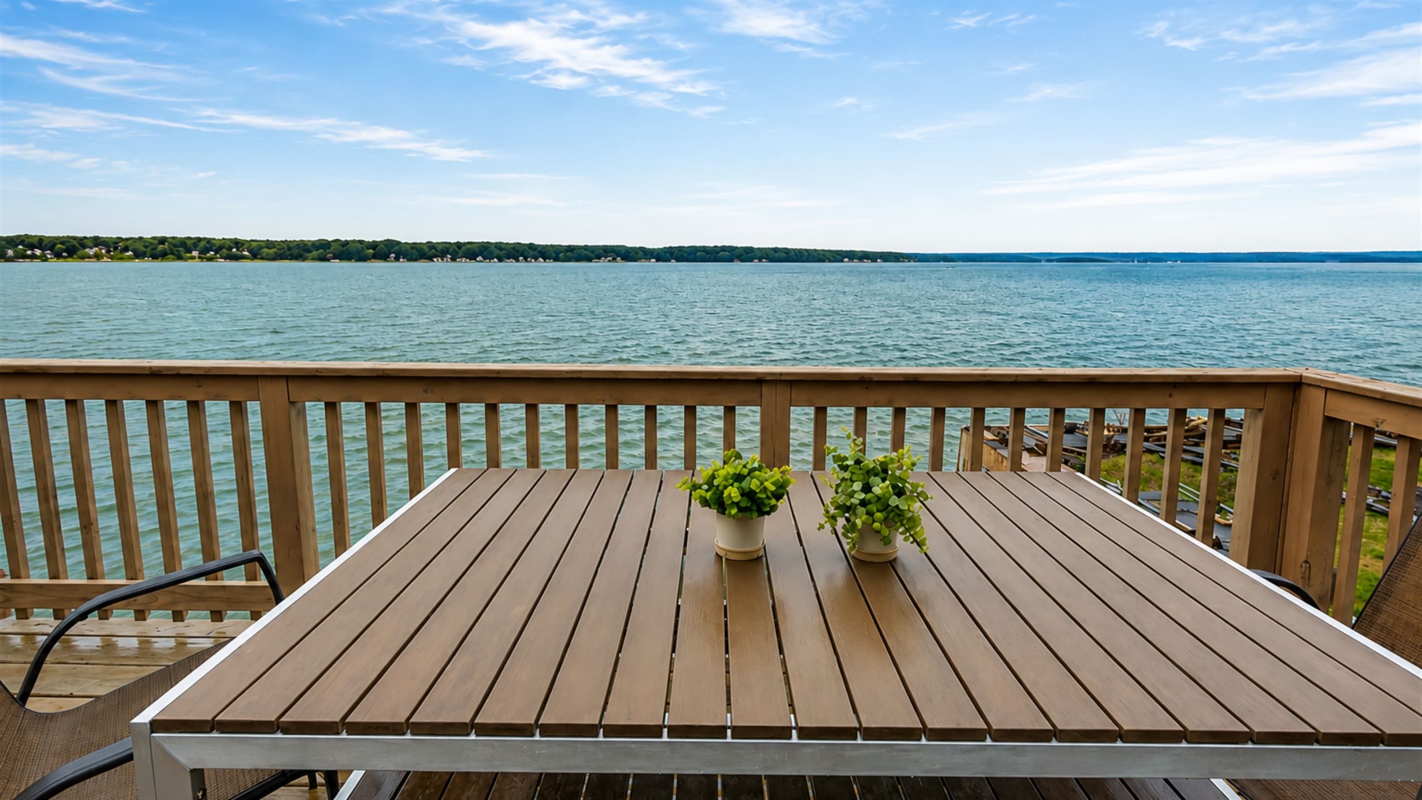 Deck dining table overlooking the water