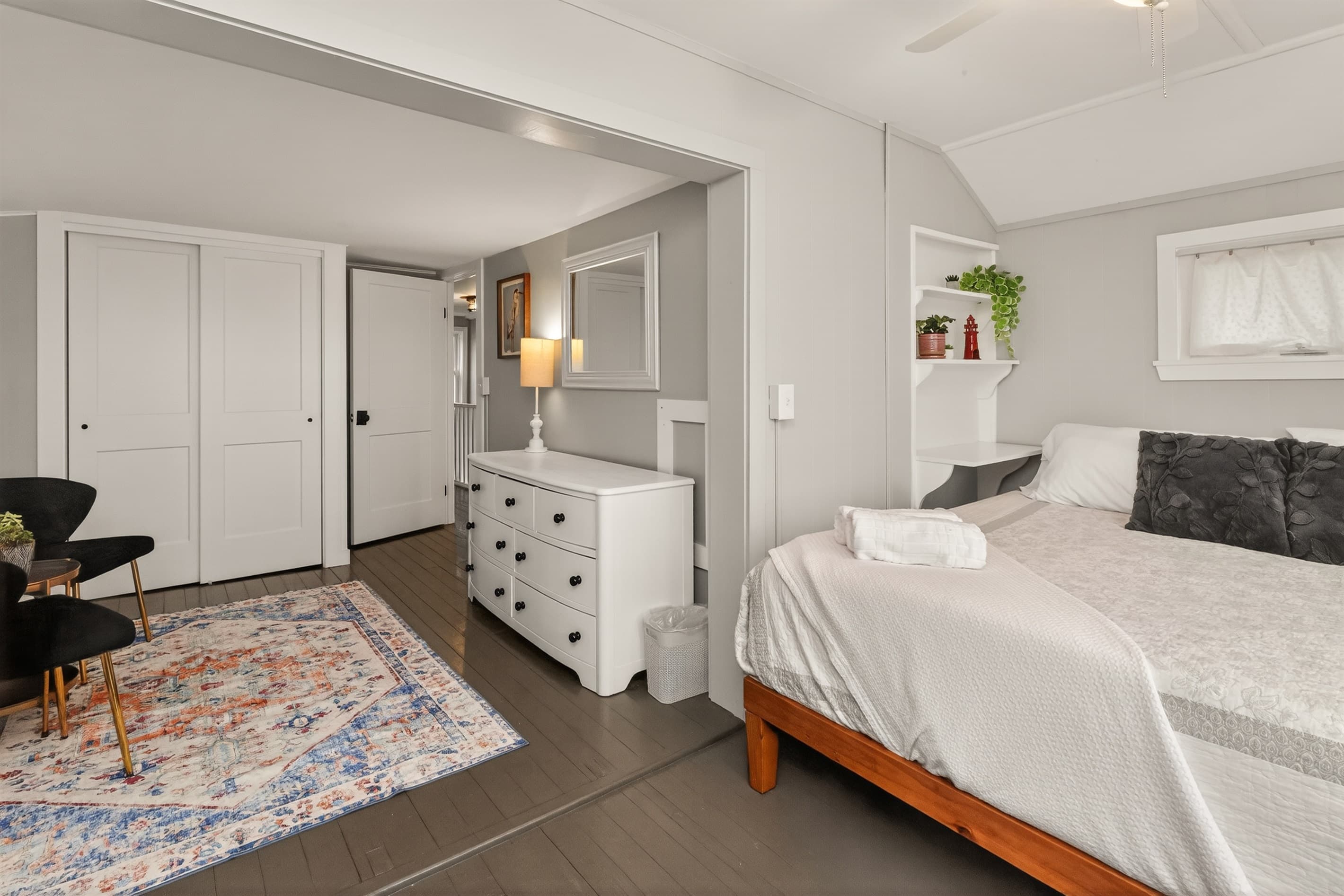 Bedroom with dresser and area rug