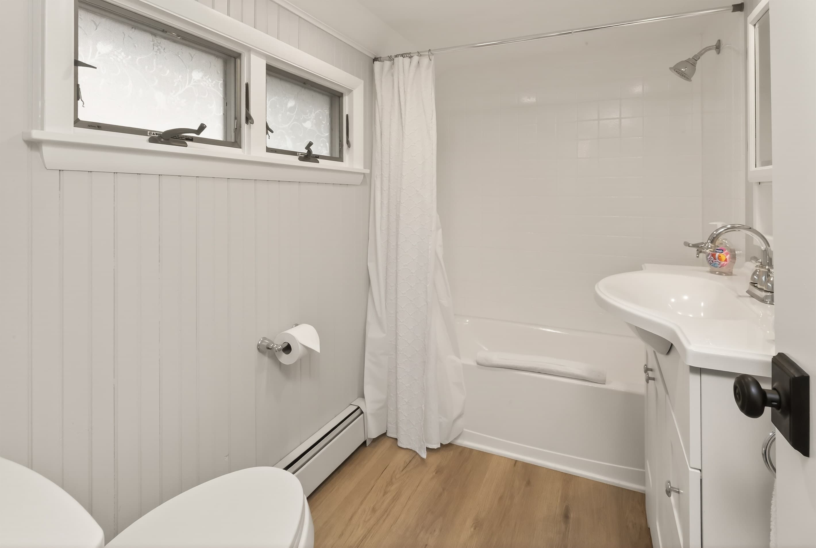 Bathroom with bathtub and shower