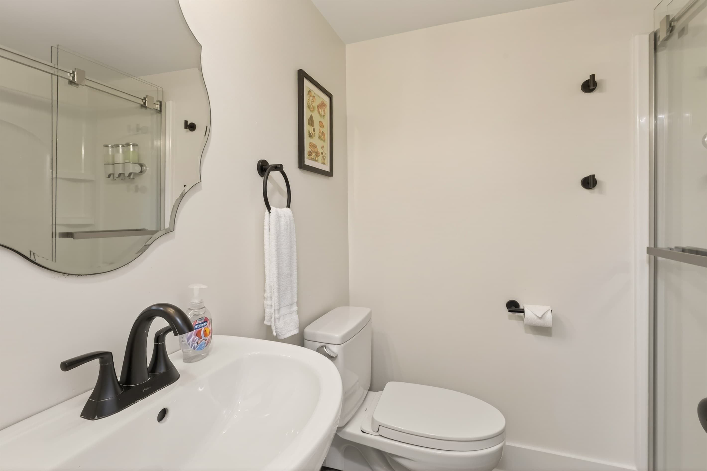Full bathroom with glass enclosed shower