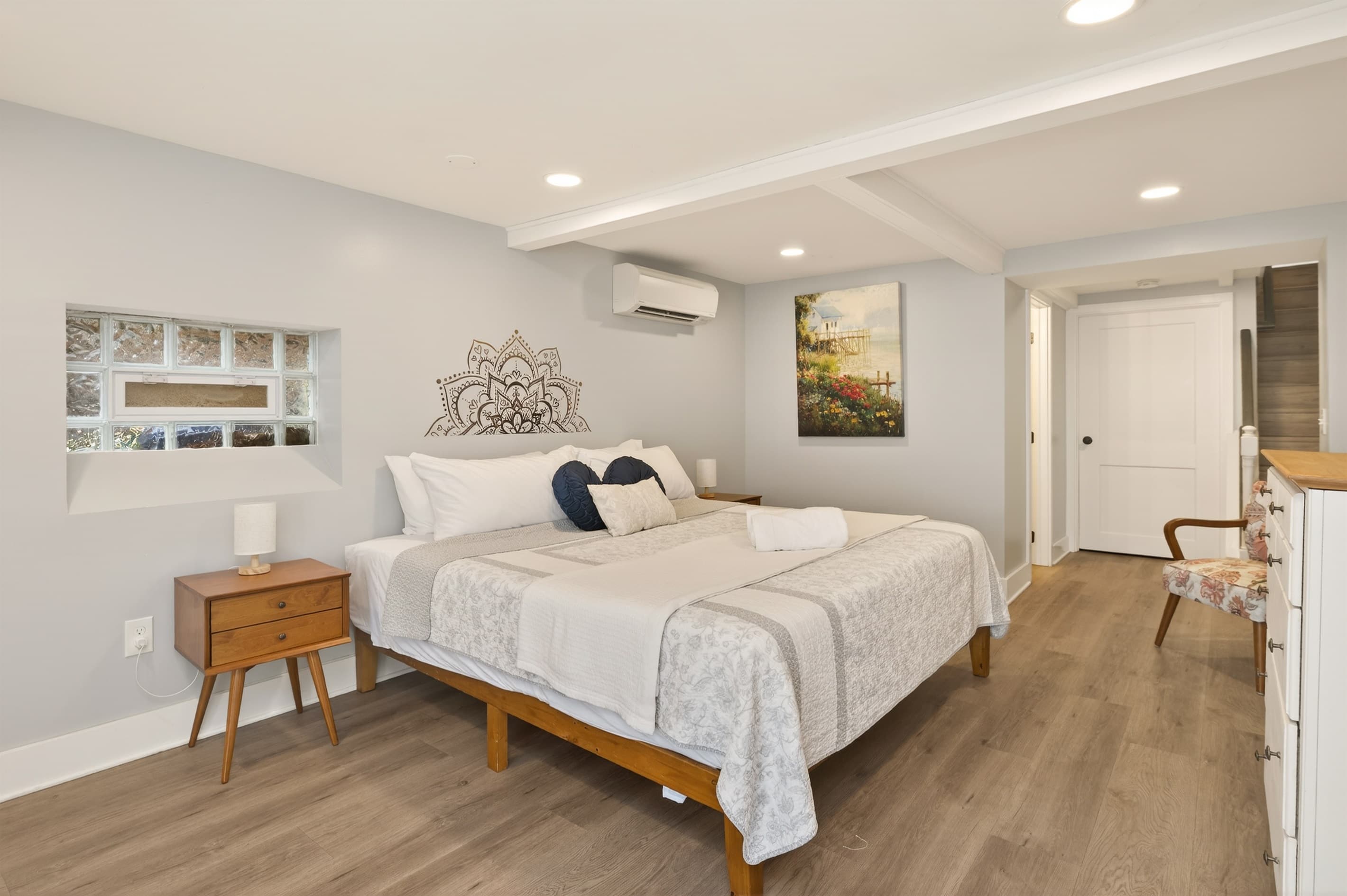 Bright bedroom with wood-framed bed