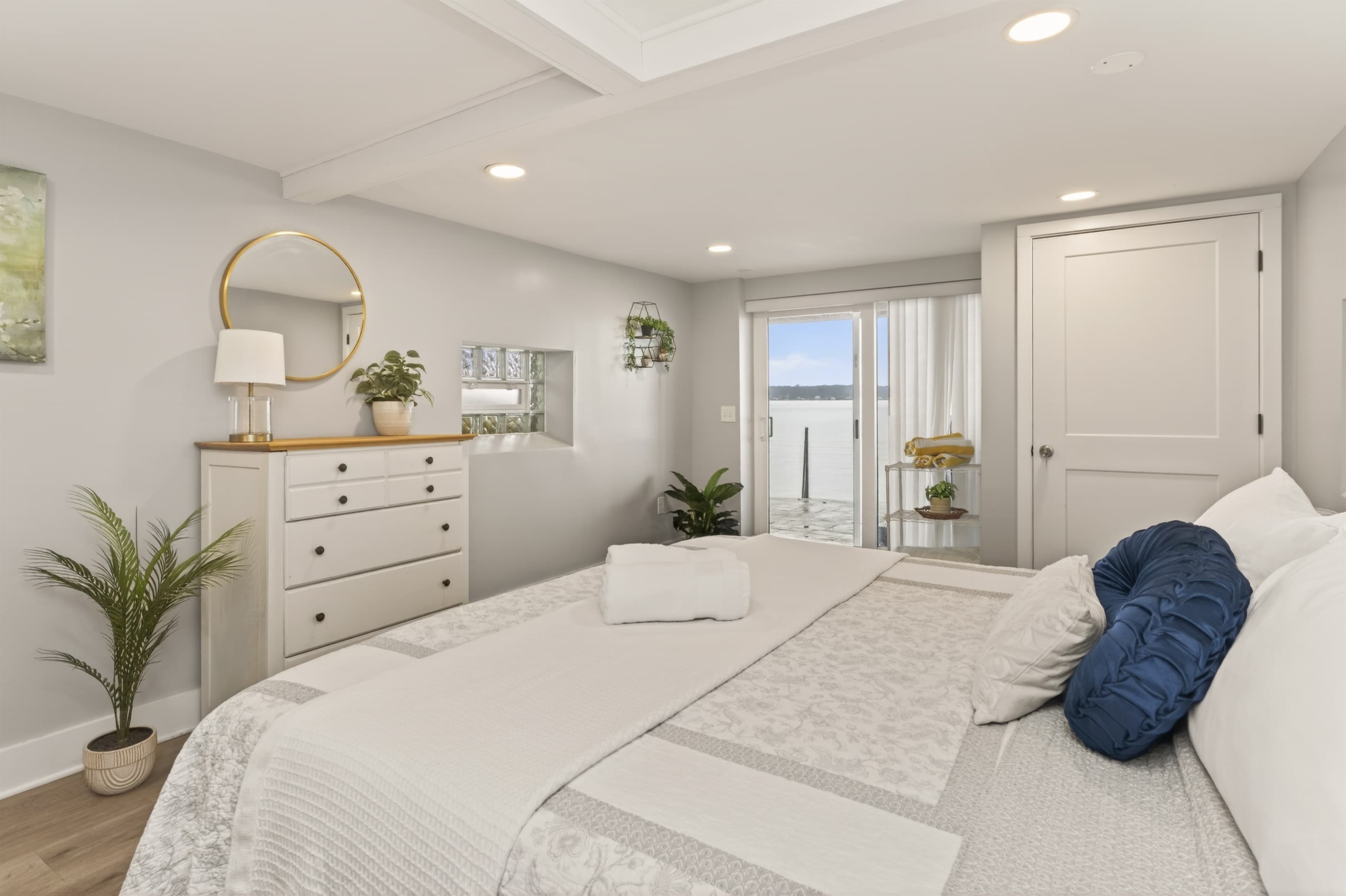 Bedroom with dresser and adjoining doorway