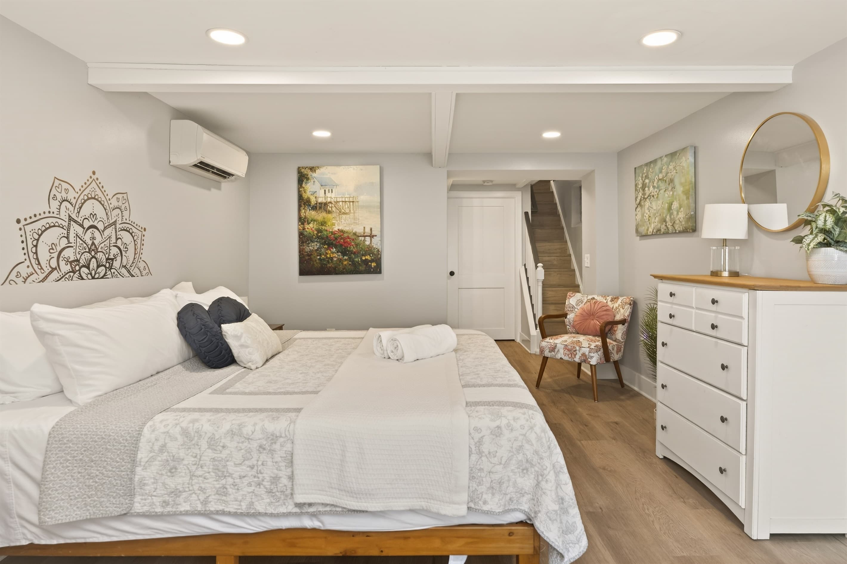 Bedroom with hardwood floors and dresser