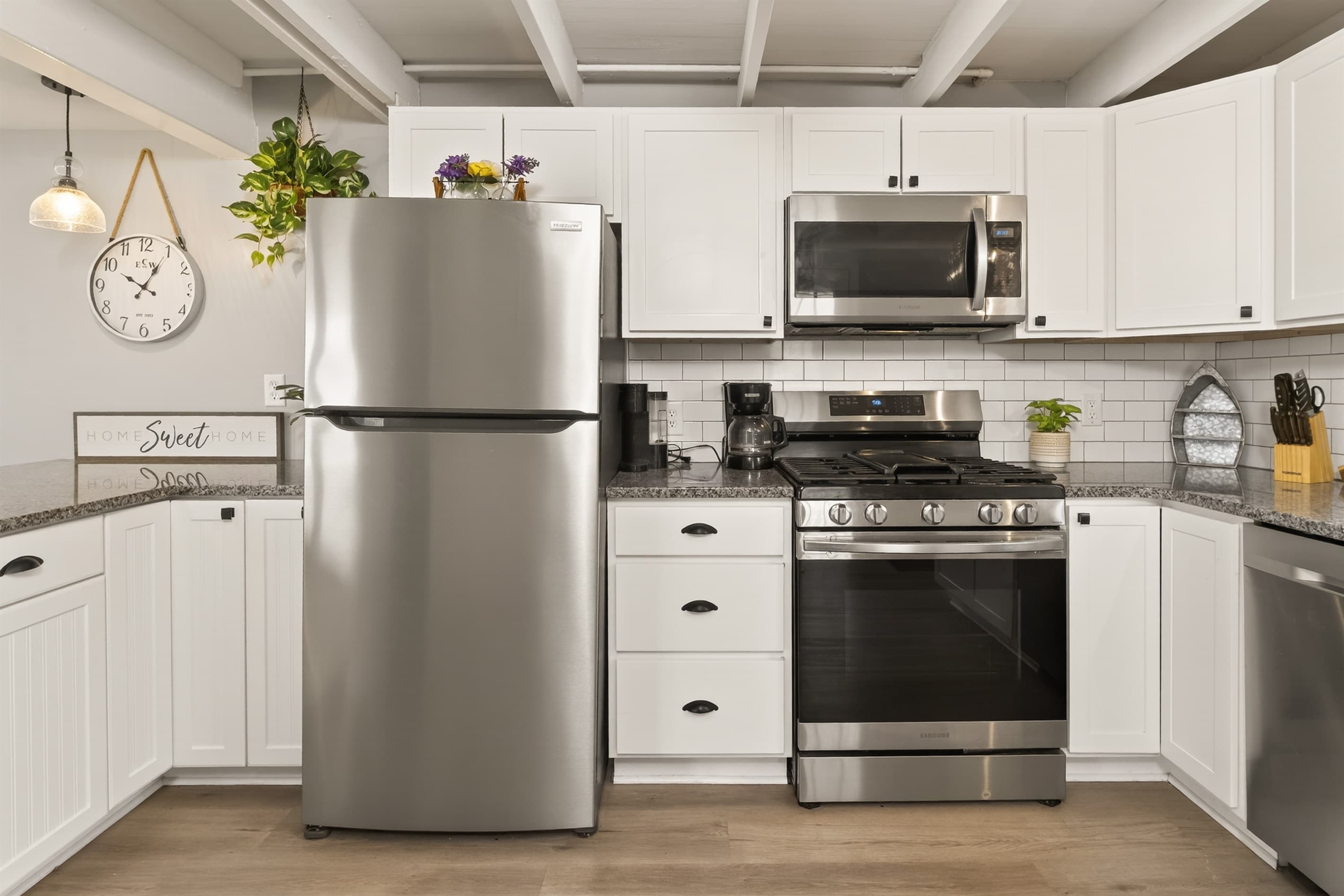 Kitchen with full-size refrigerator and stove