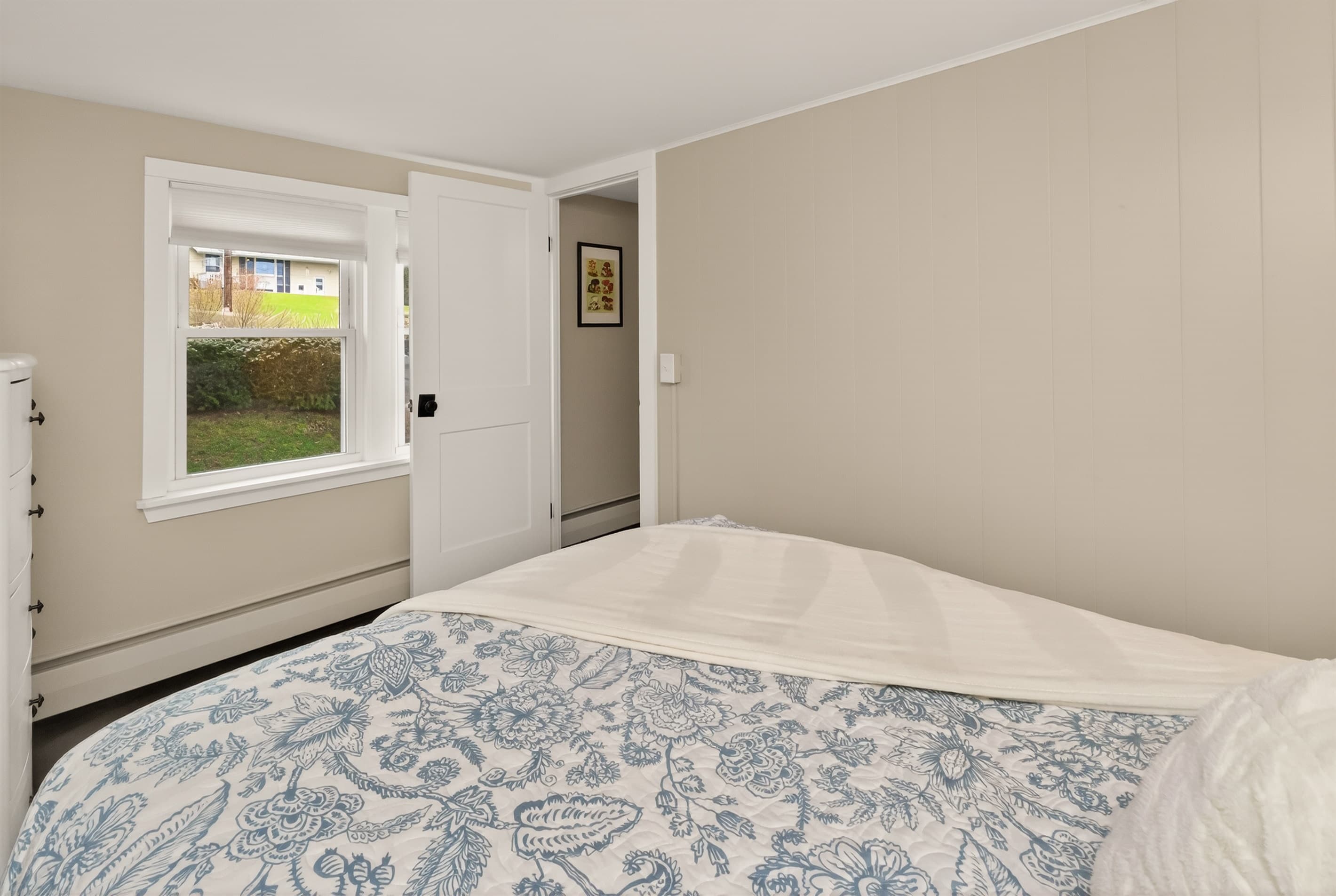 Bed positioned beside the adjoining doorway