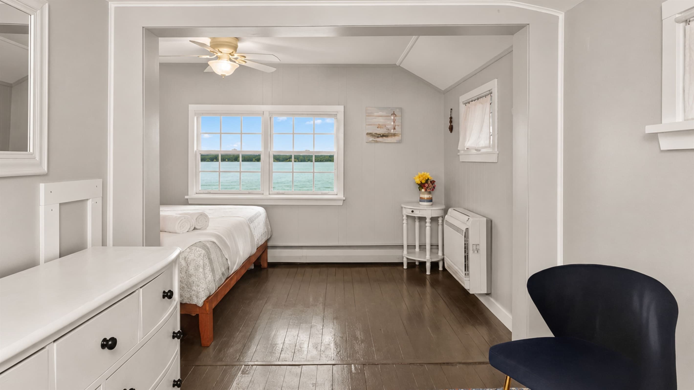 Bedroom with hardwood floors and natural light