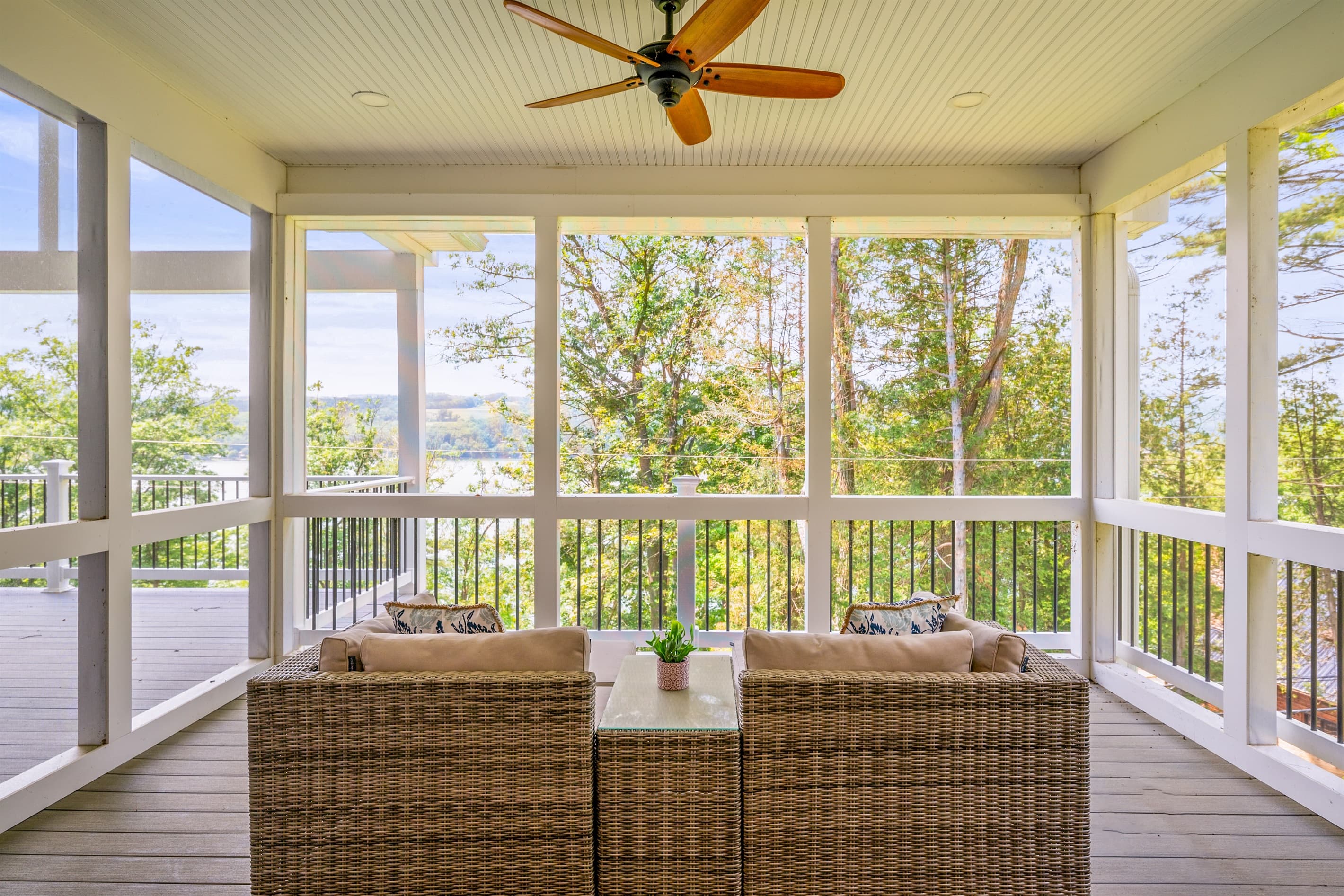 Screened porch with cushioned seating