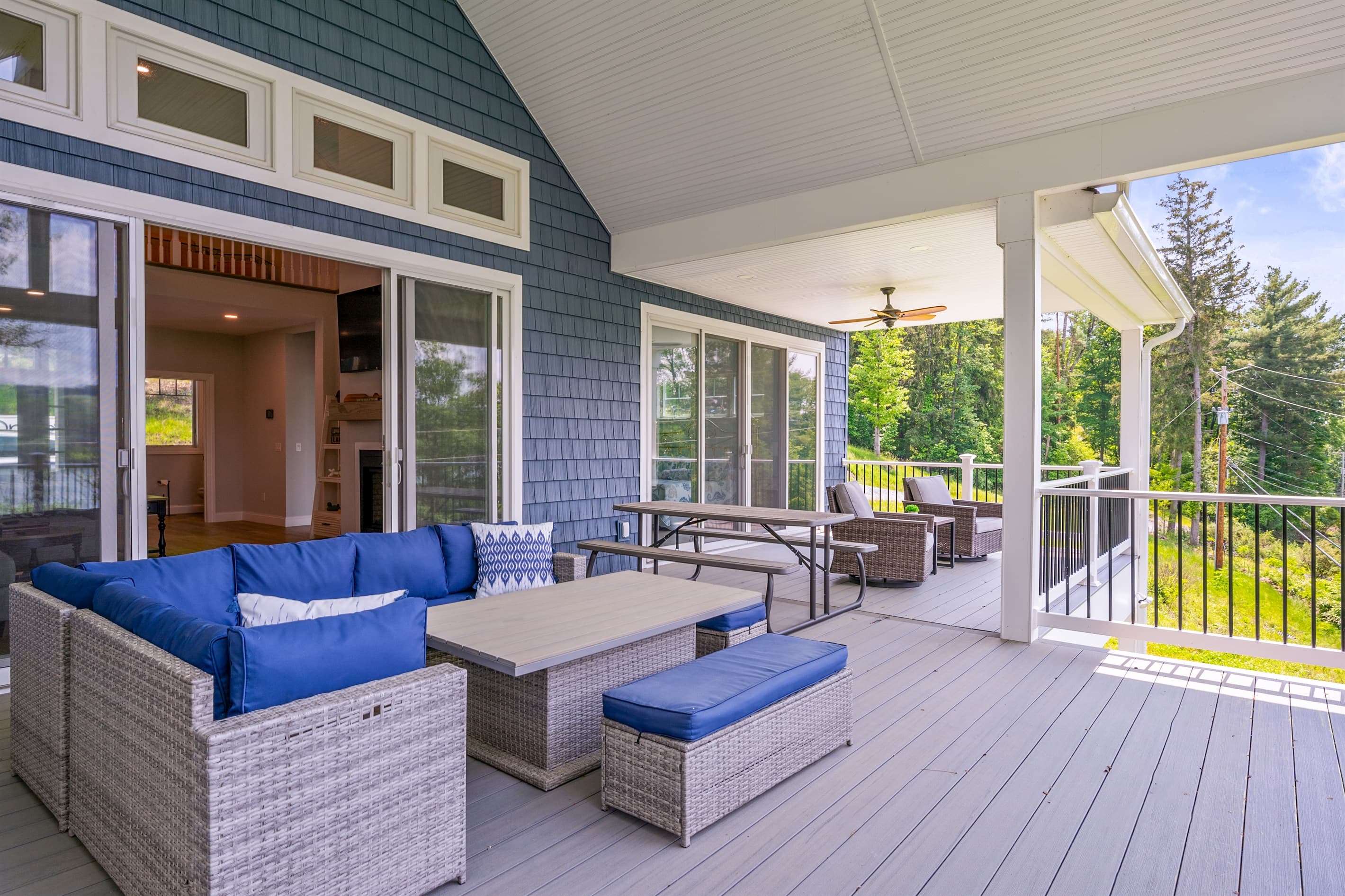 Covered deck with blue sectional seating