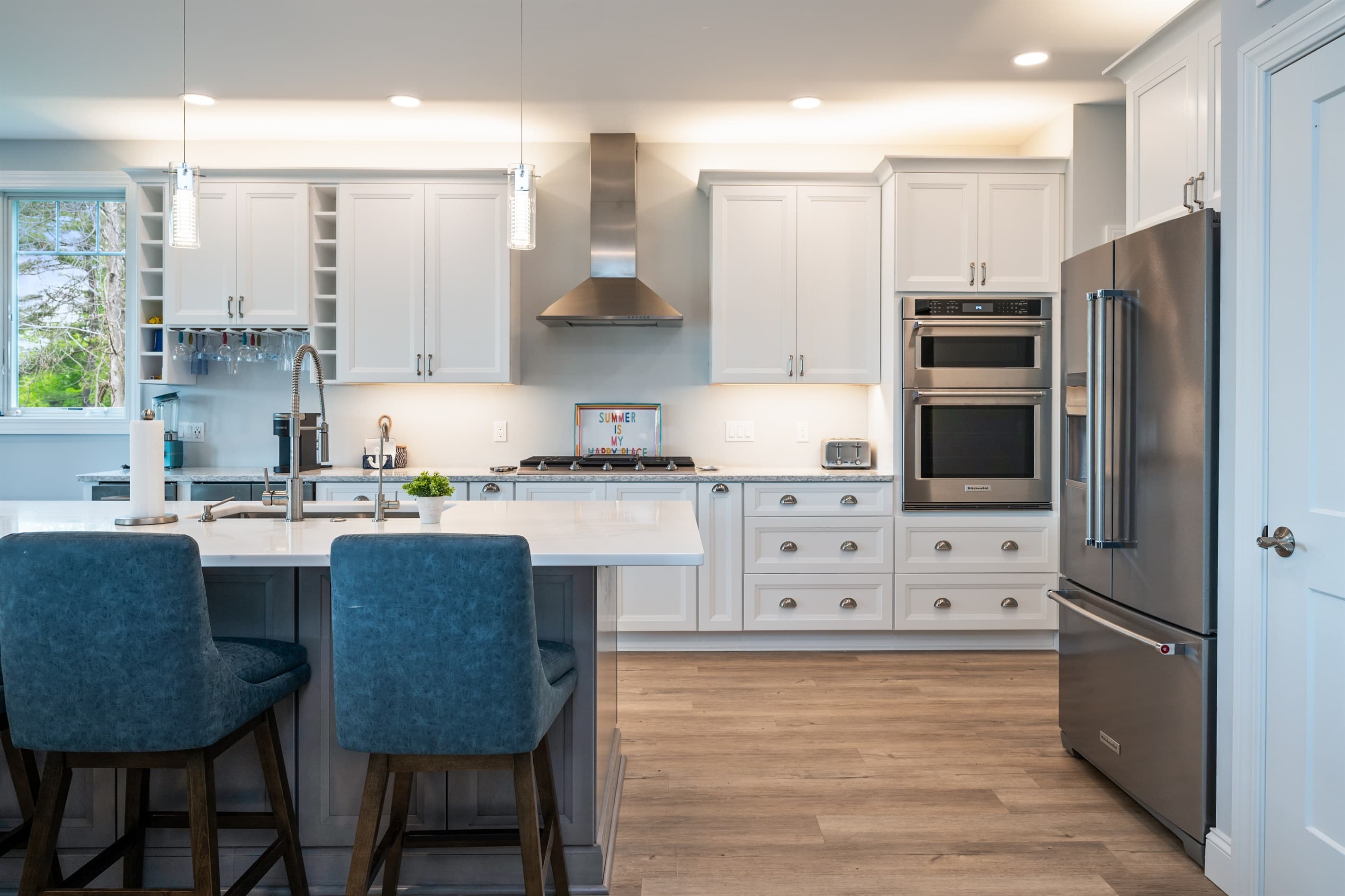 Kitchen with double ovens and gas range