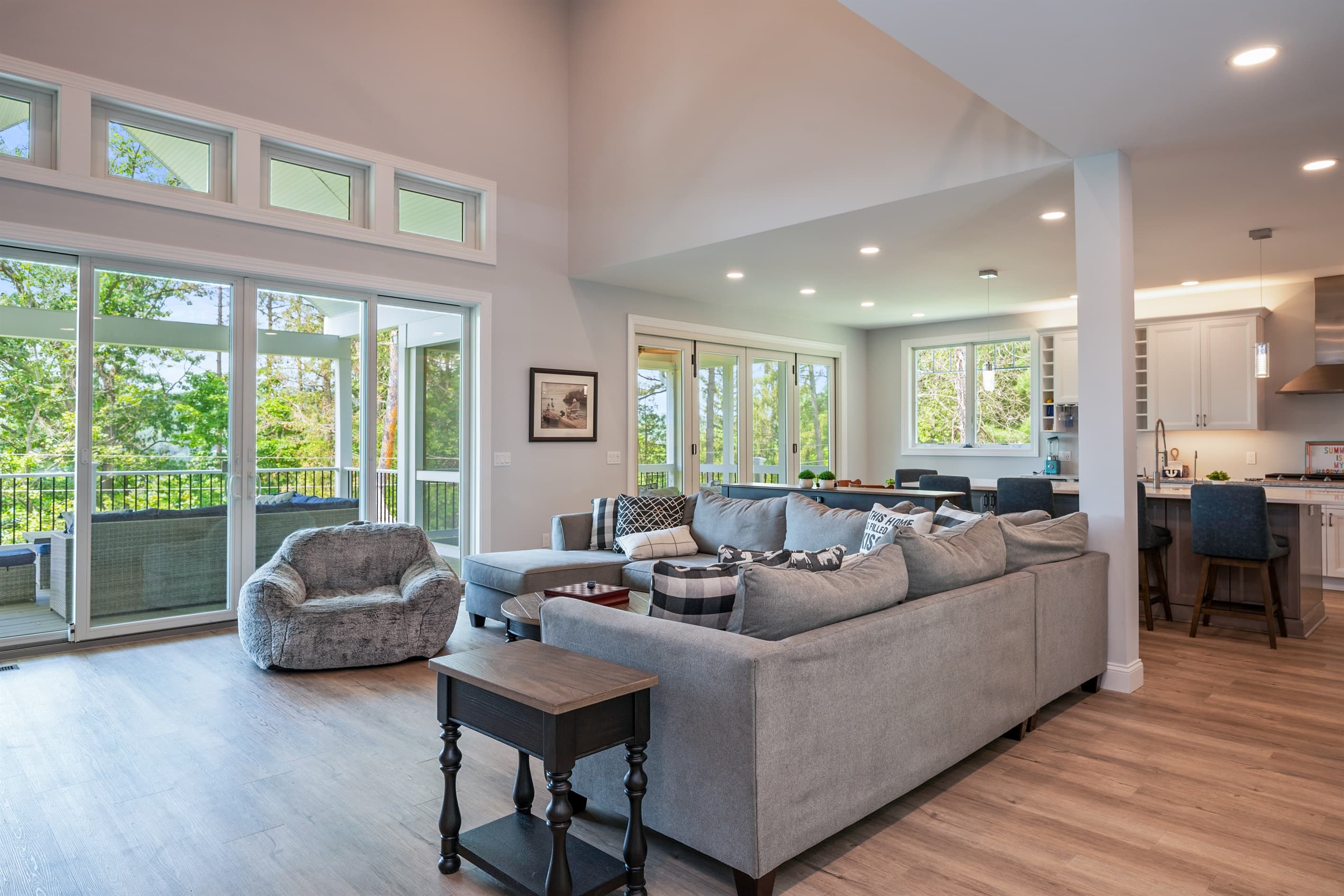 Window-lined living room with lake views