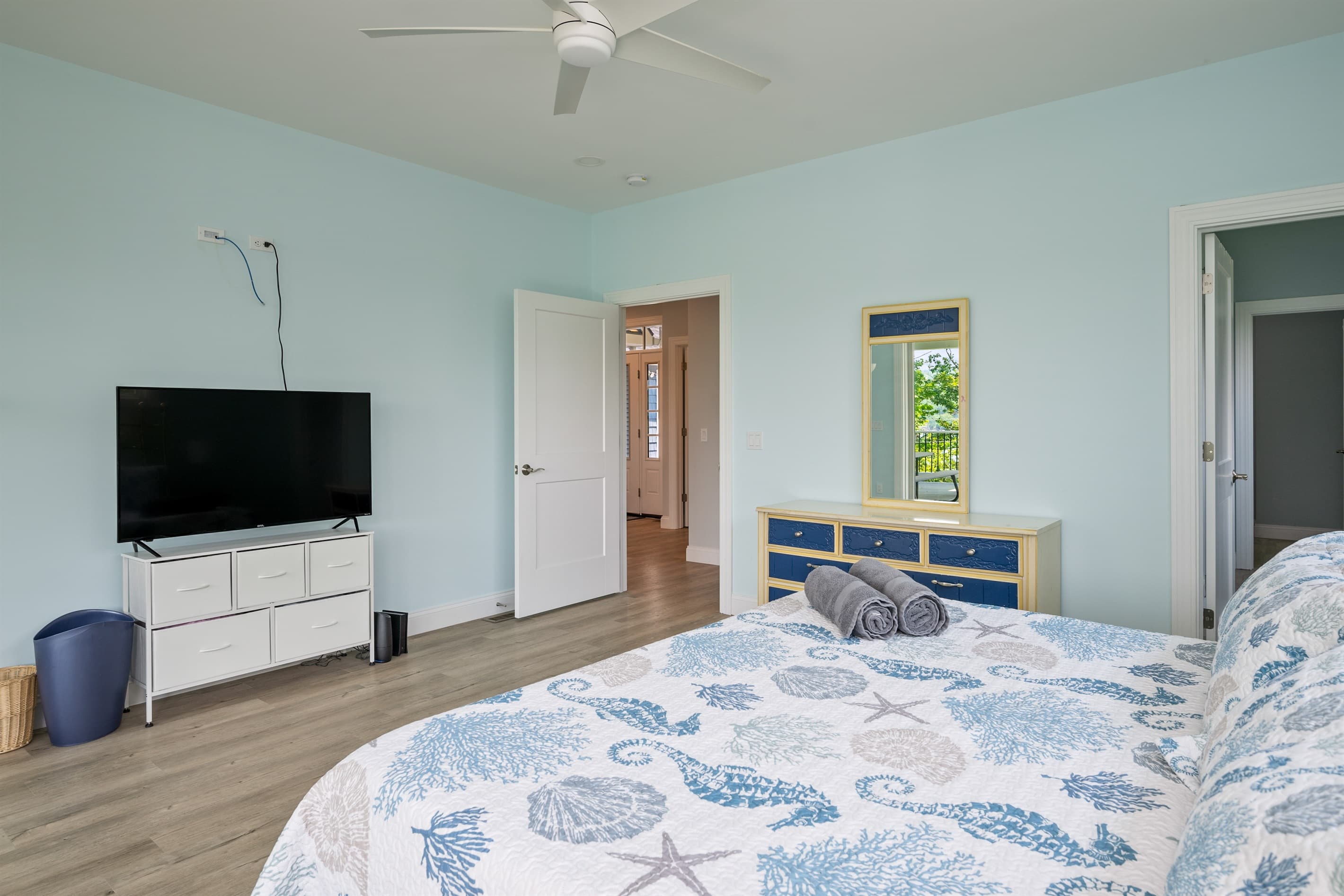 Bedroom with wall-mounted television