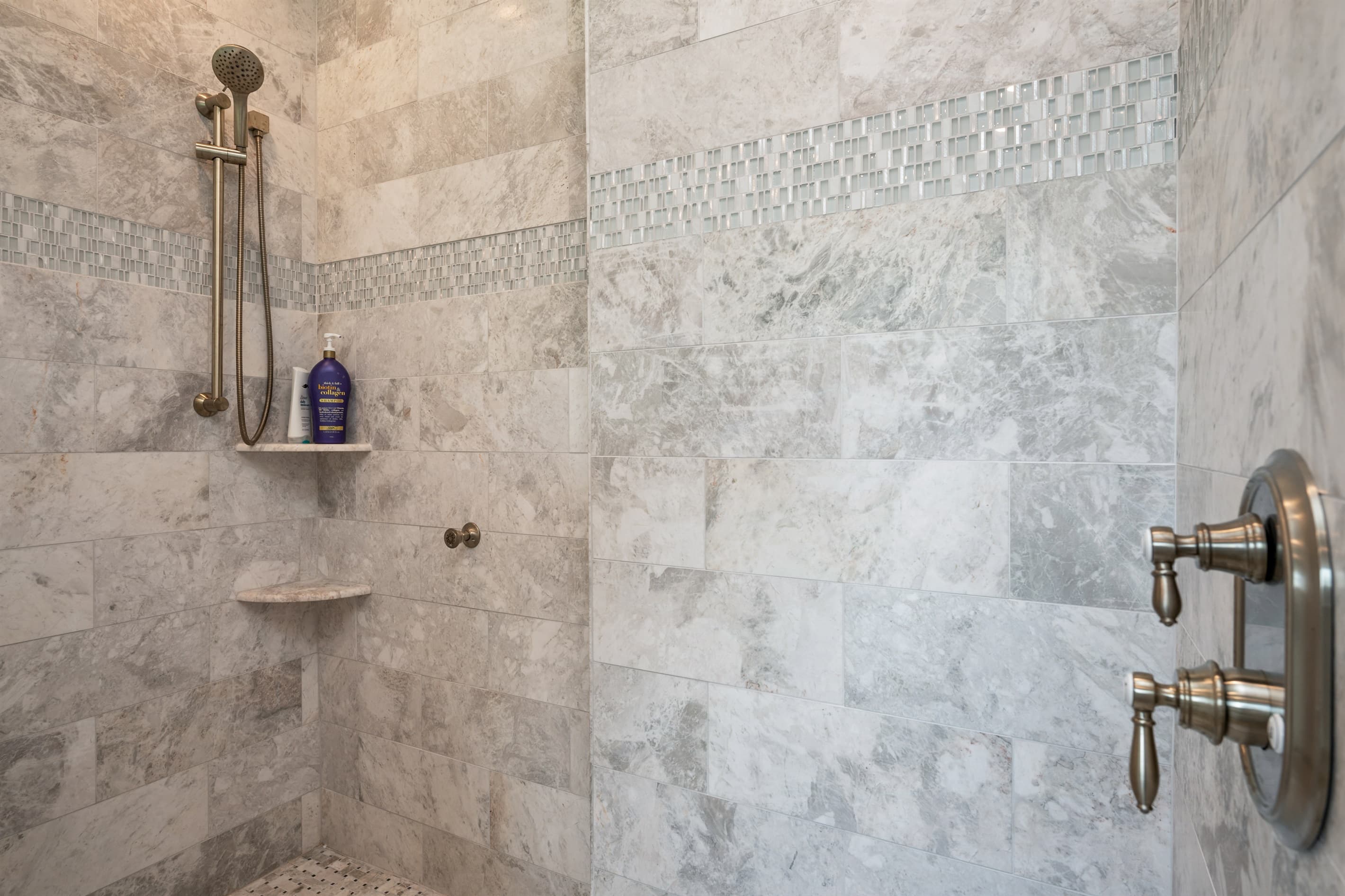 Walk-in shower with tiled walls