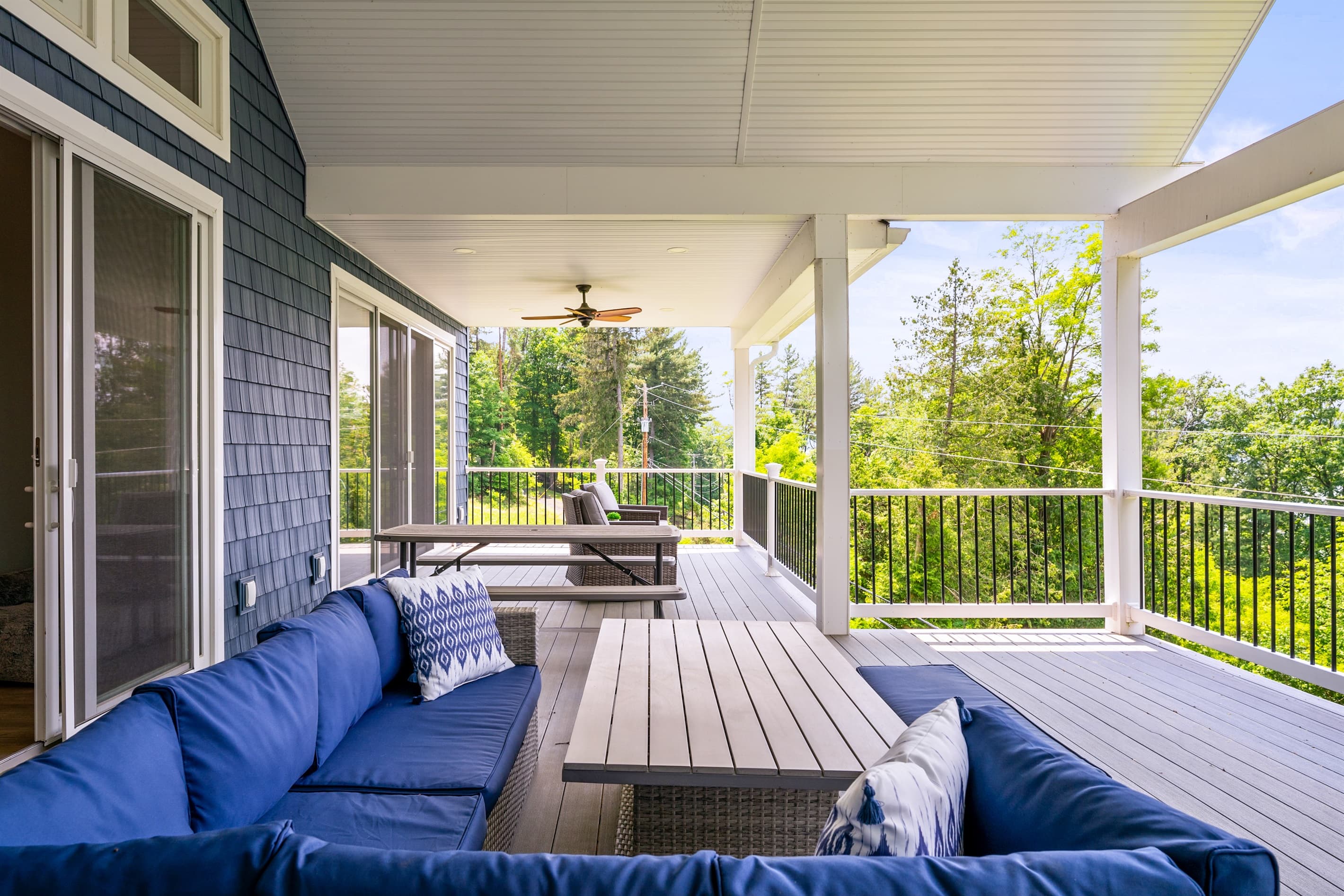 Covered deck with seating and ceiling fans